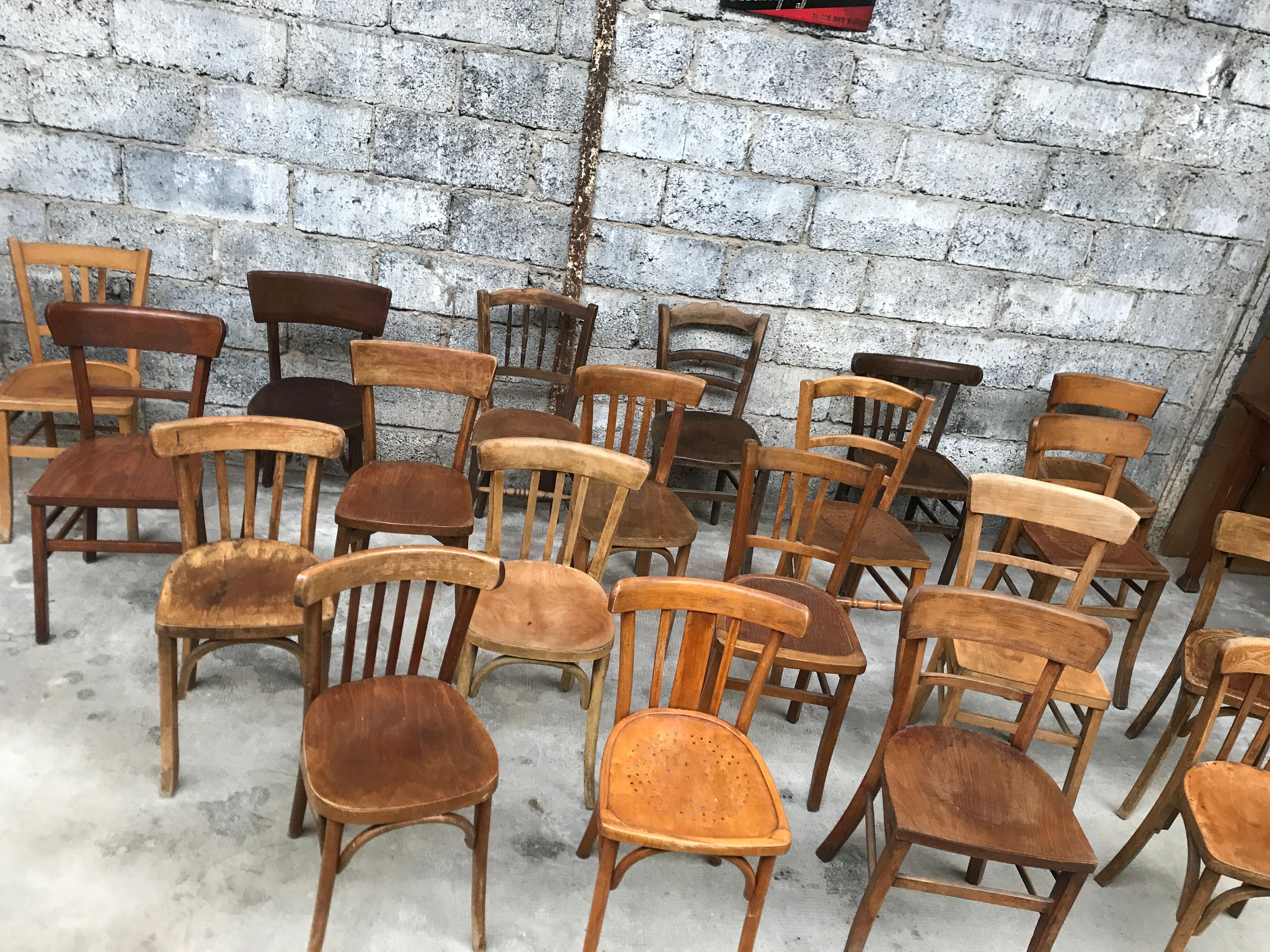 Set of 15 mismatched curved wood bistro chairs
