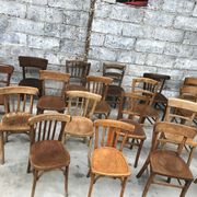 Set of 15 mismatched curved wood bistro chairs