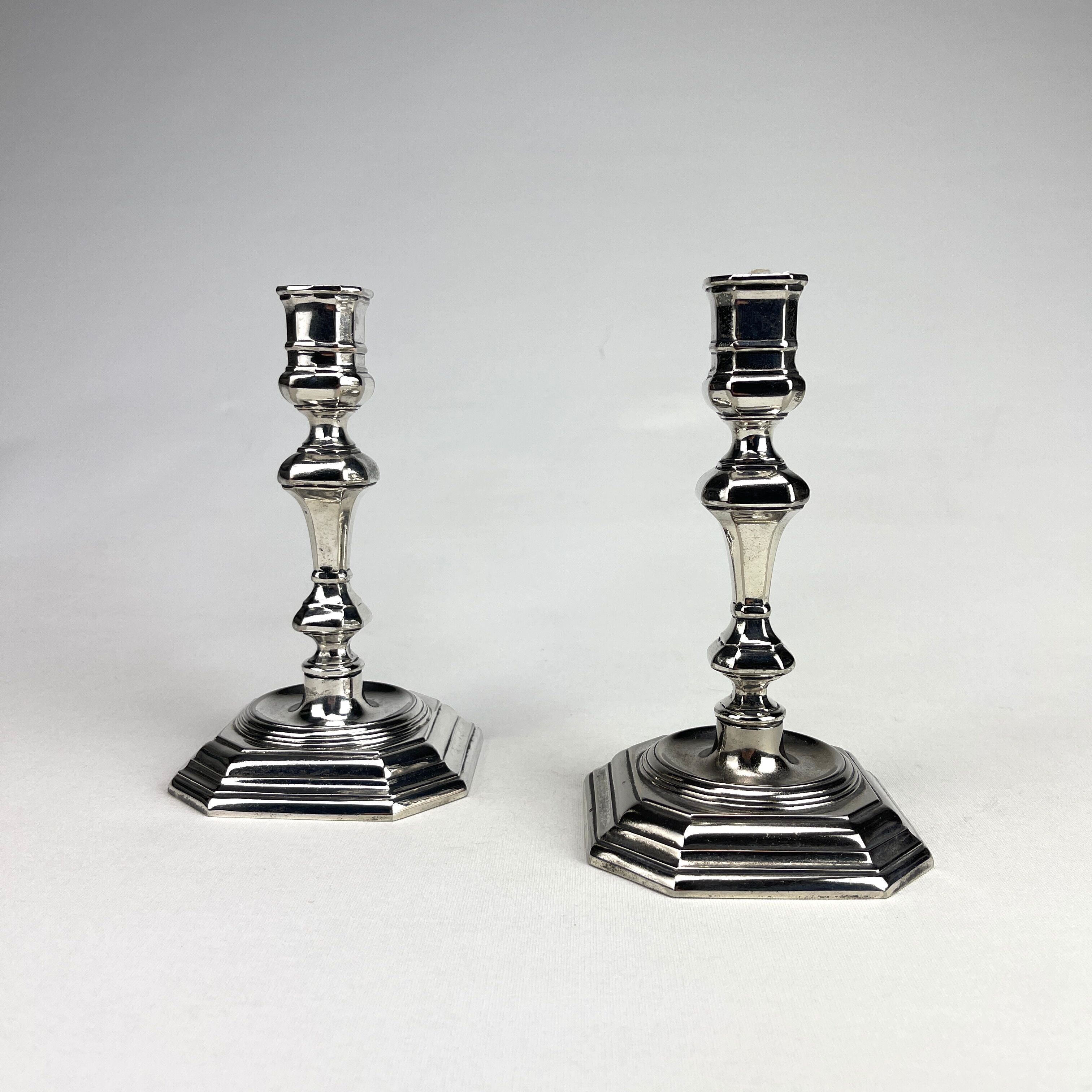 Pair of antique candlesticks in silver metal
