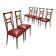 Set of six 1950s chairs with burgundy seats.
