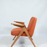 Fauteuil scandinave orange brûlée conclu par Chierowski