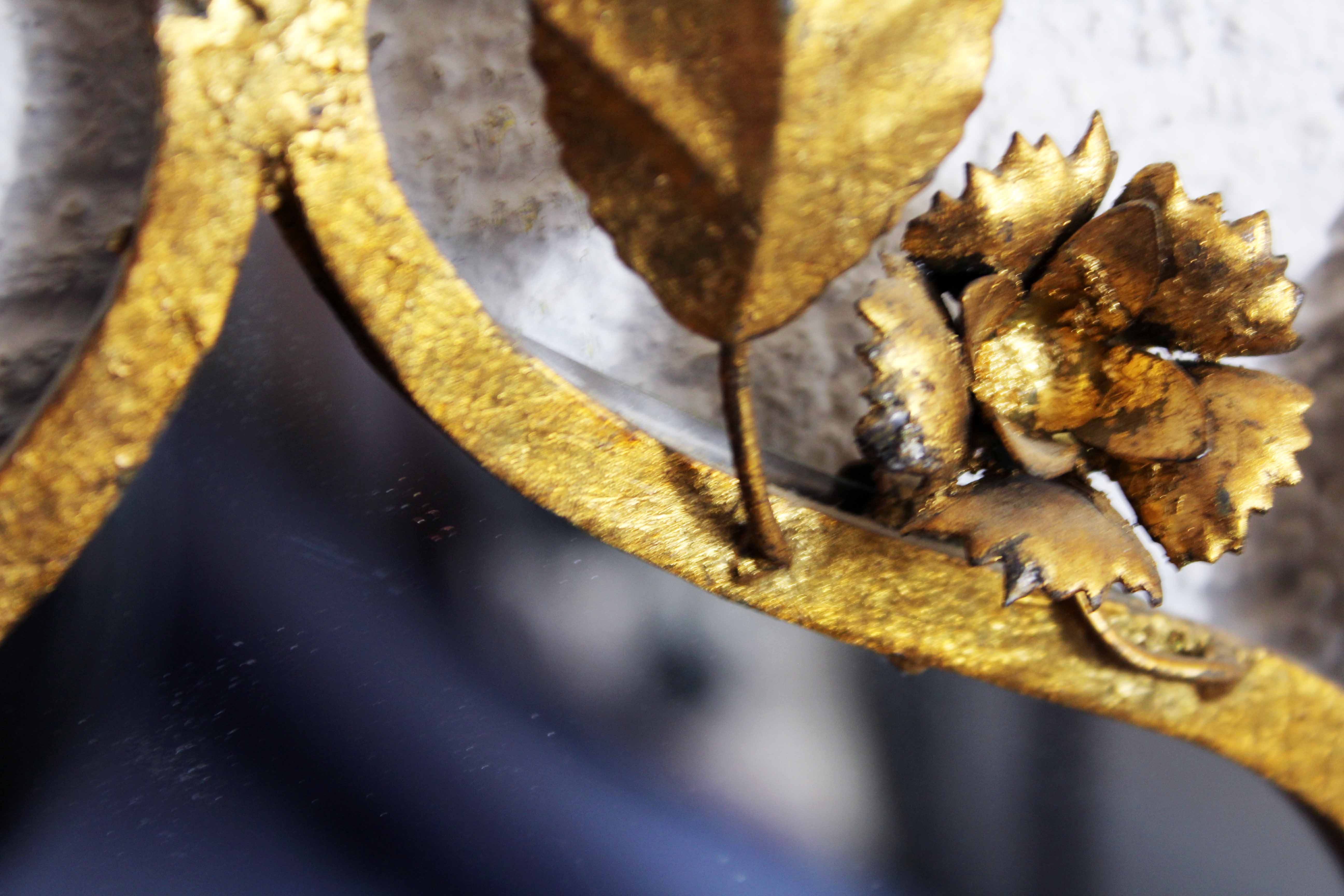 Old candlestick mirror gilded with leaf