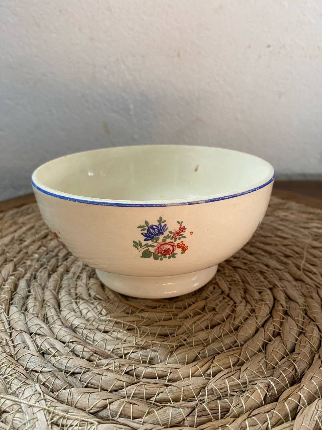 Flowery bowl with blue edging.