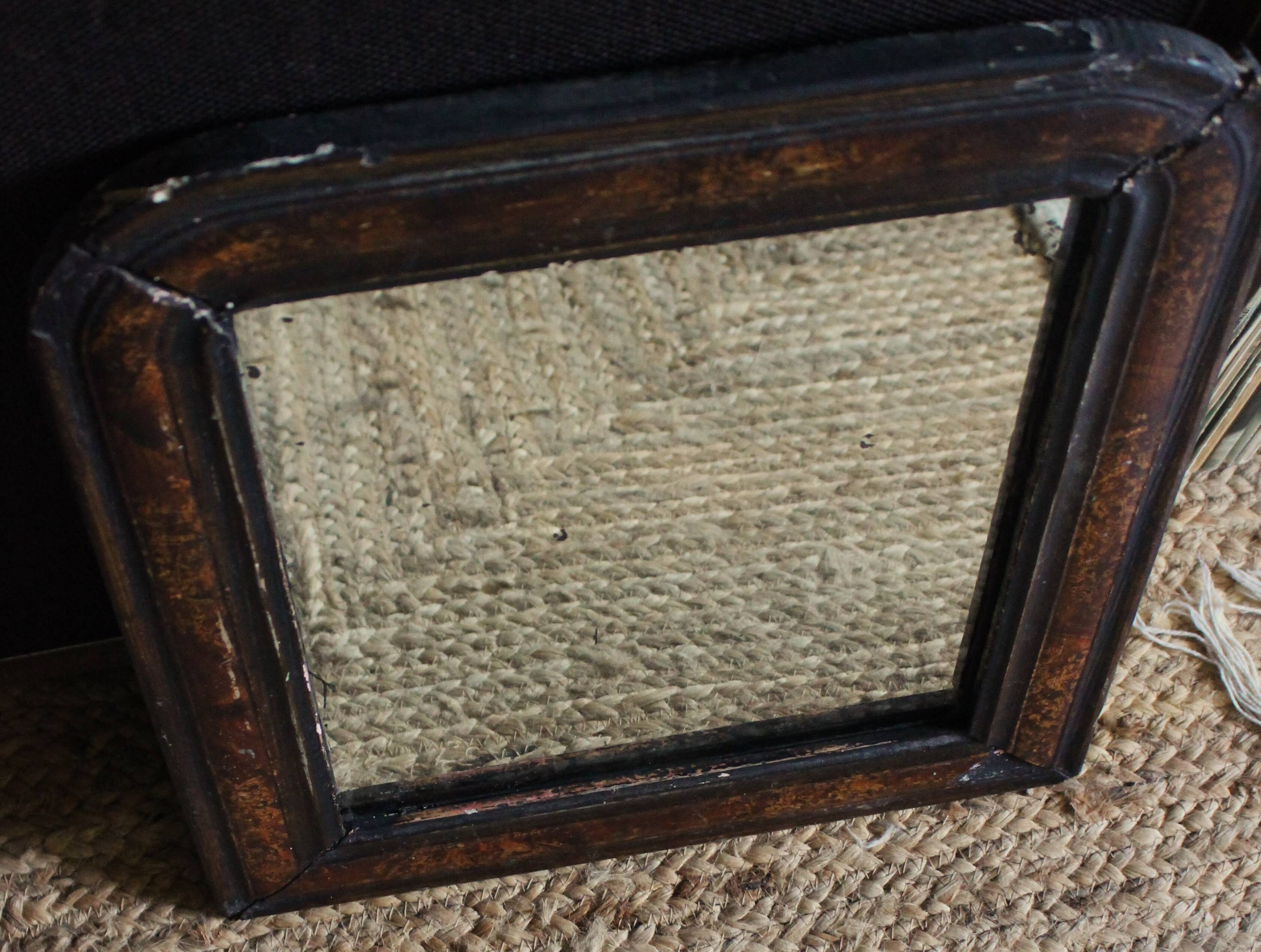 Antique Louis Philippe mirror in black and brown.