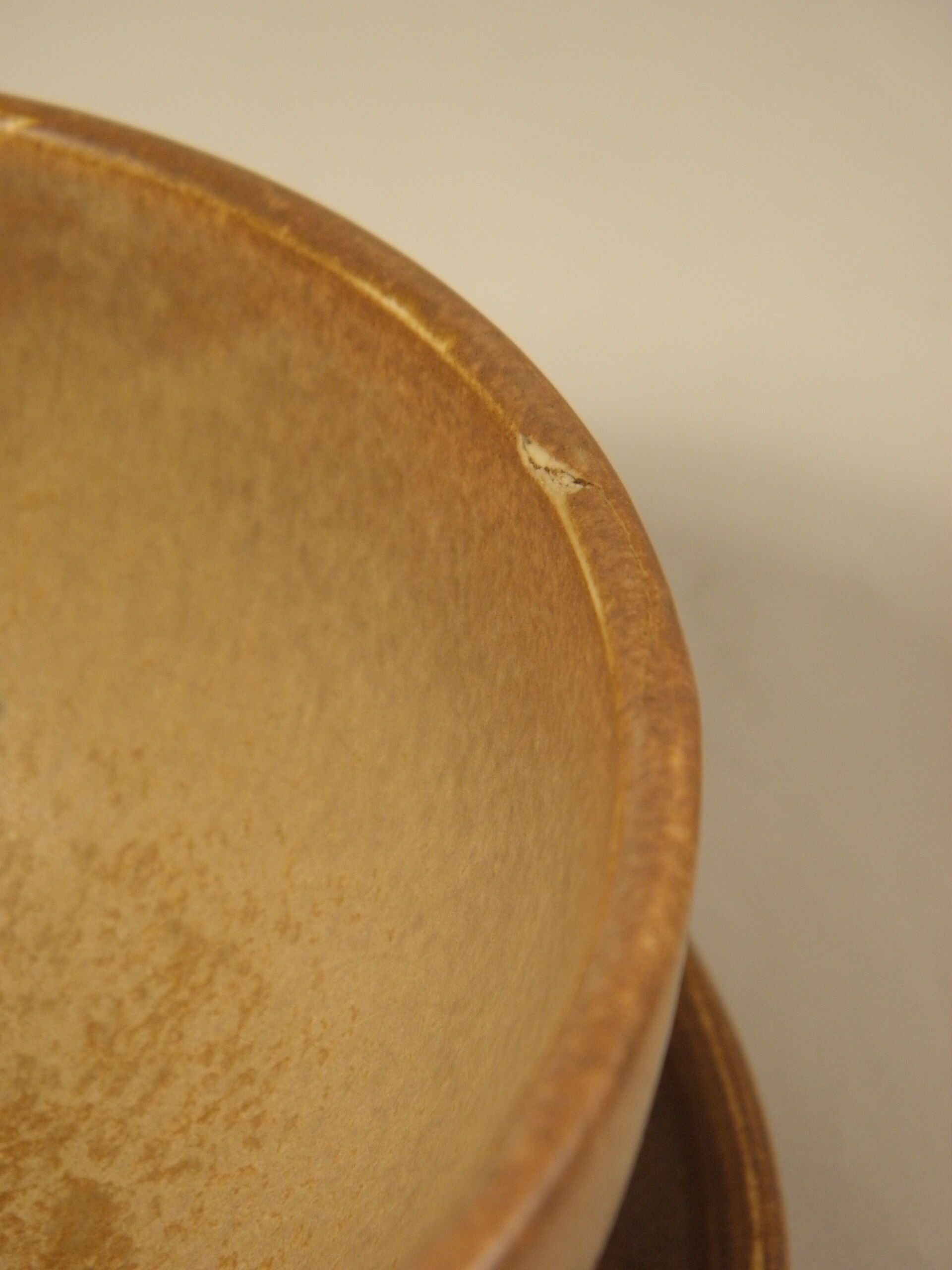 Two sandstone bowls and saucers