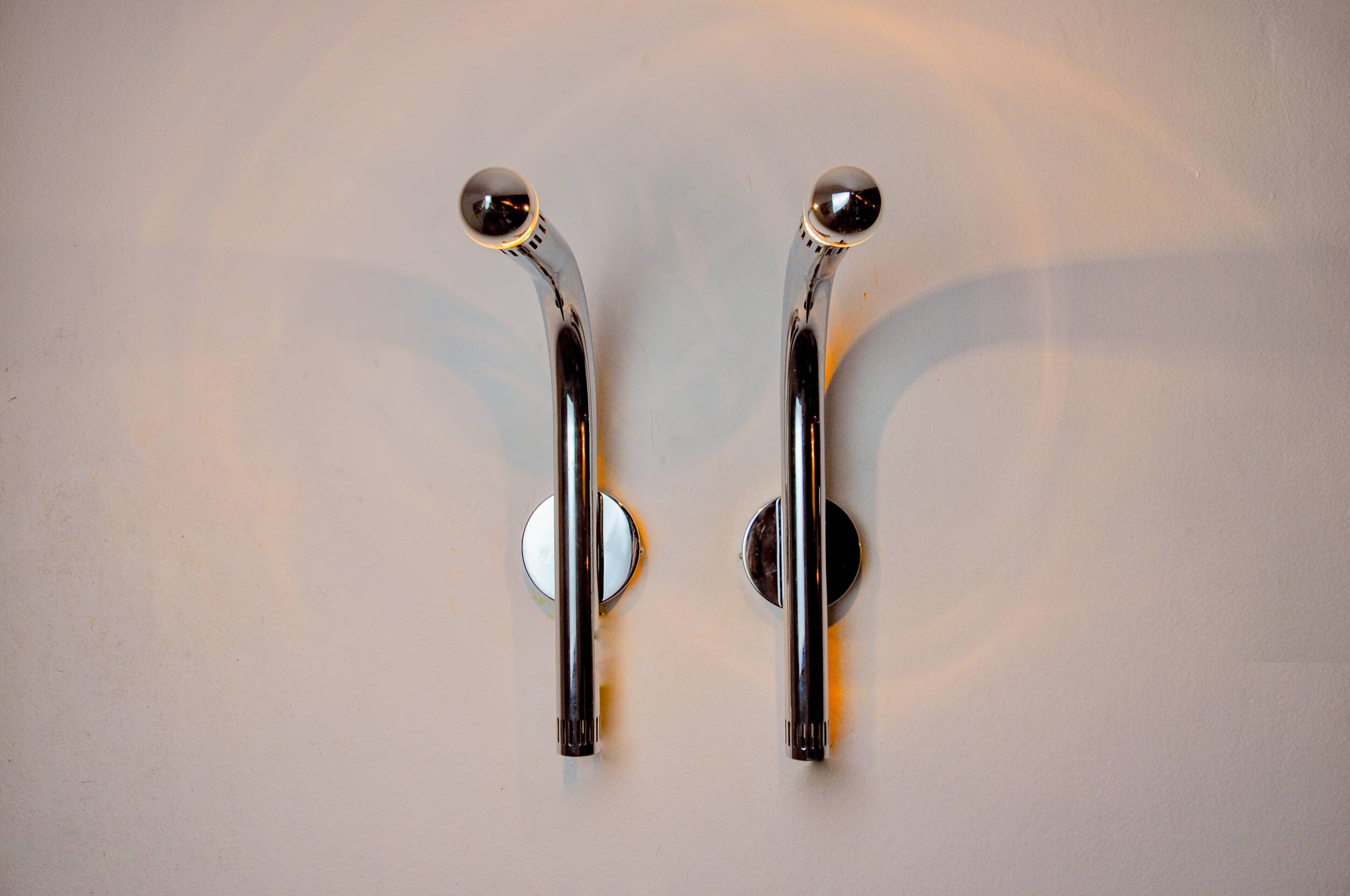 Pair of space-age tubular wall lights, chrome-plated metal, Italy, 1970