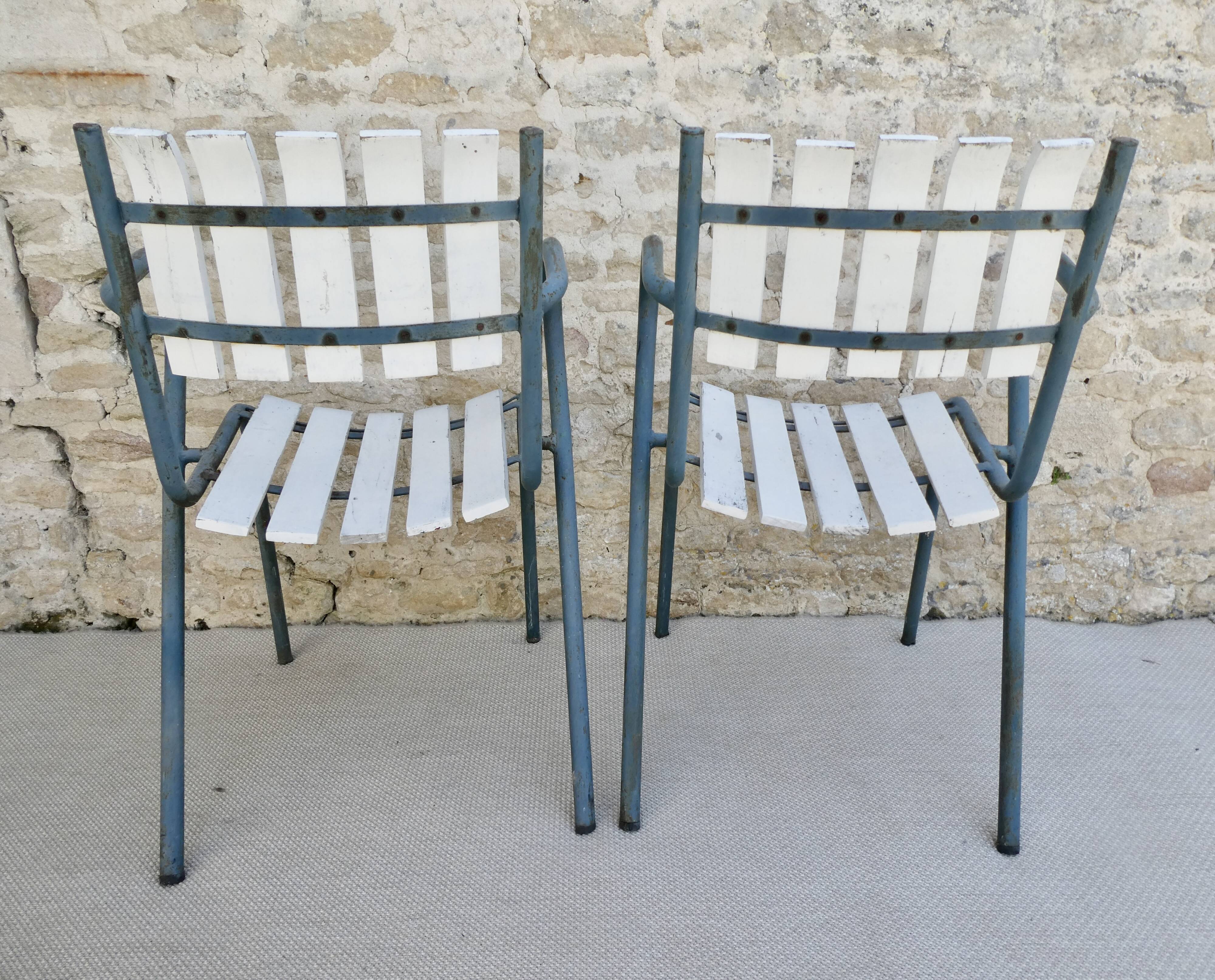 Pair of wooden and metal armchairs from the 60s
