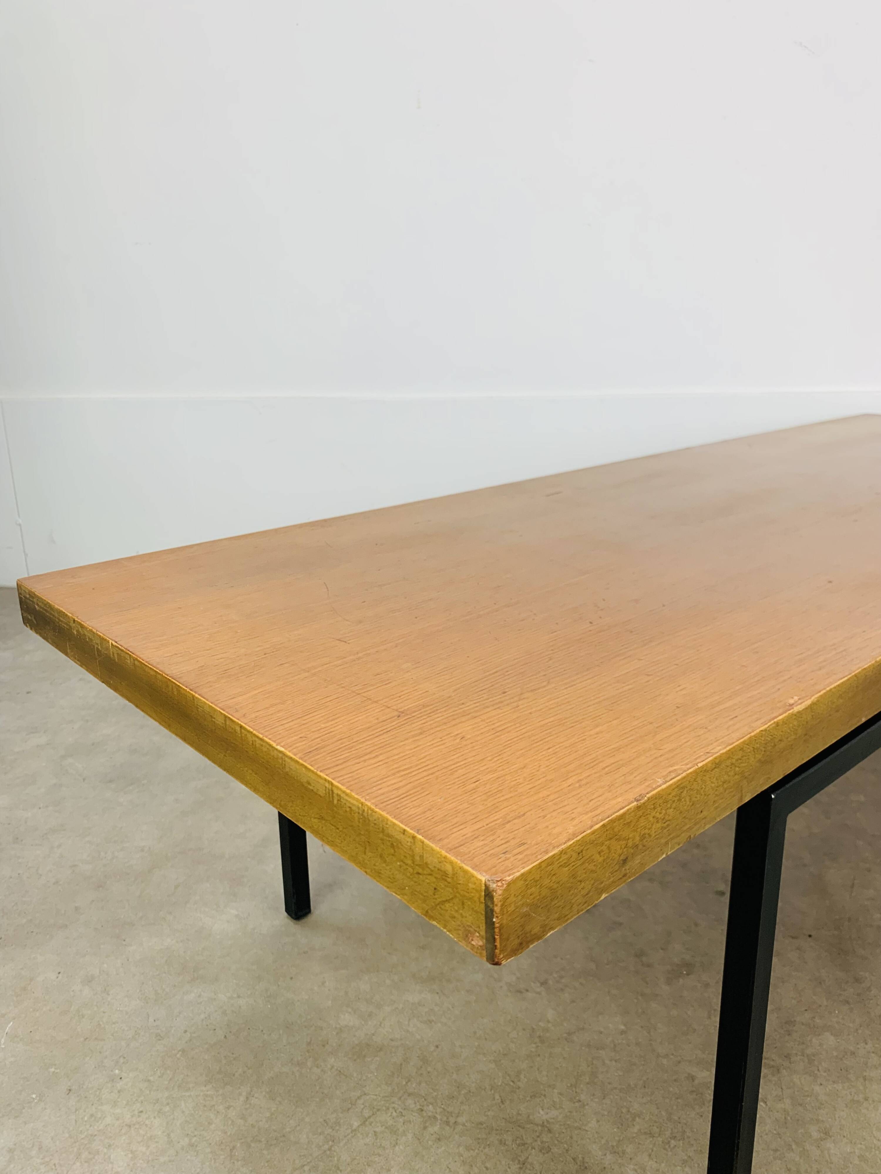 1950s modernist coffee table, wood and black metal.