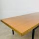 1950s modernist coffee table, wood and black metal.