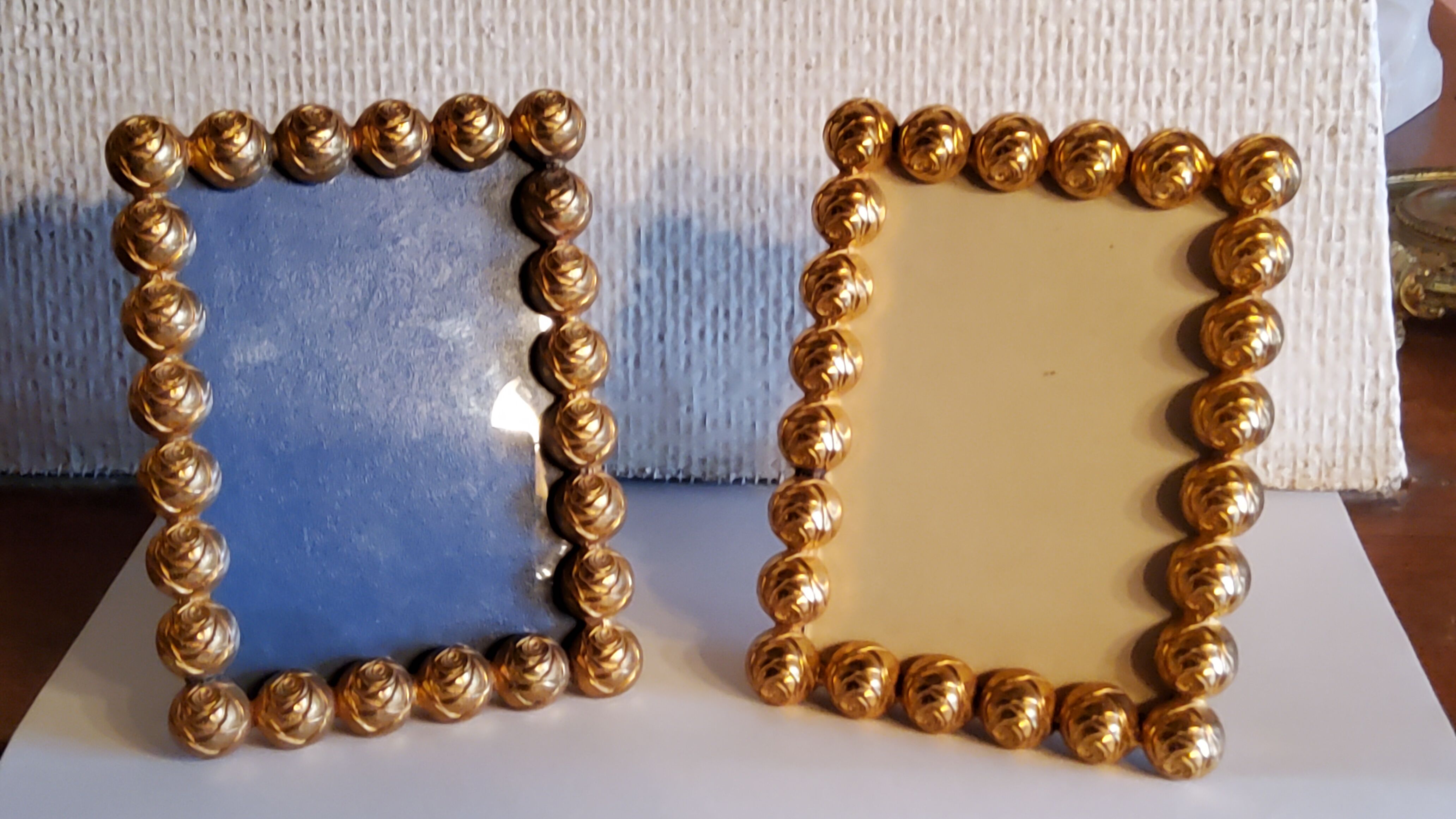 Pair of art deco photo frames in gilded bronze and gilded brass