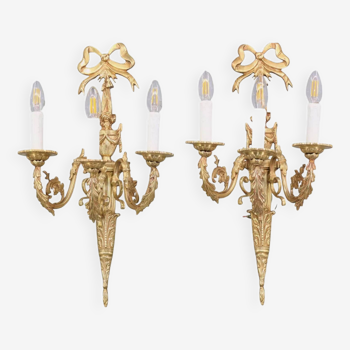 Pair of Louis XVI style wall lights in gilded & patinated bronze with three lights