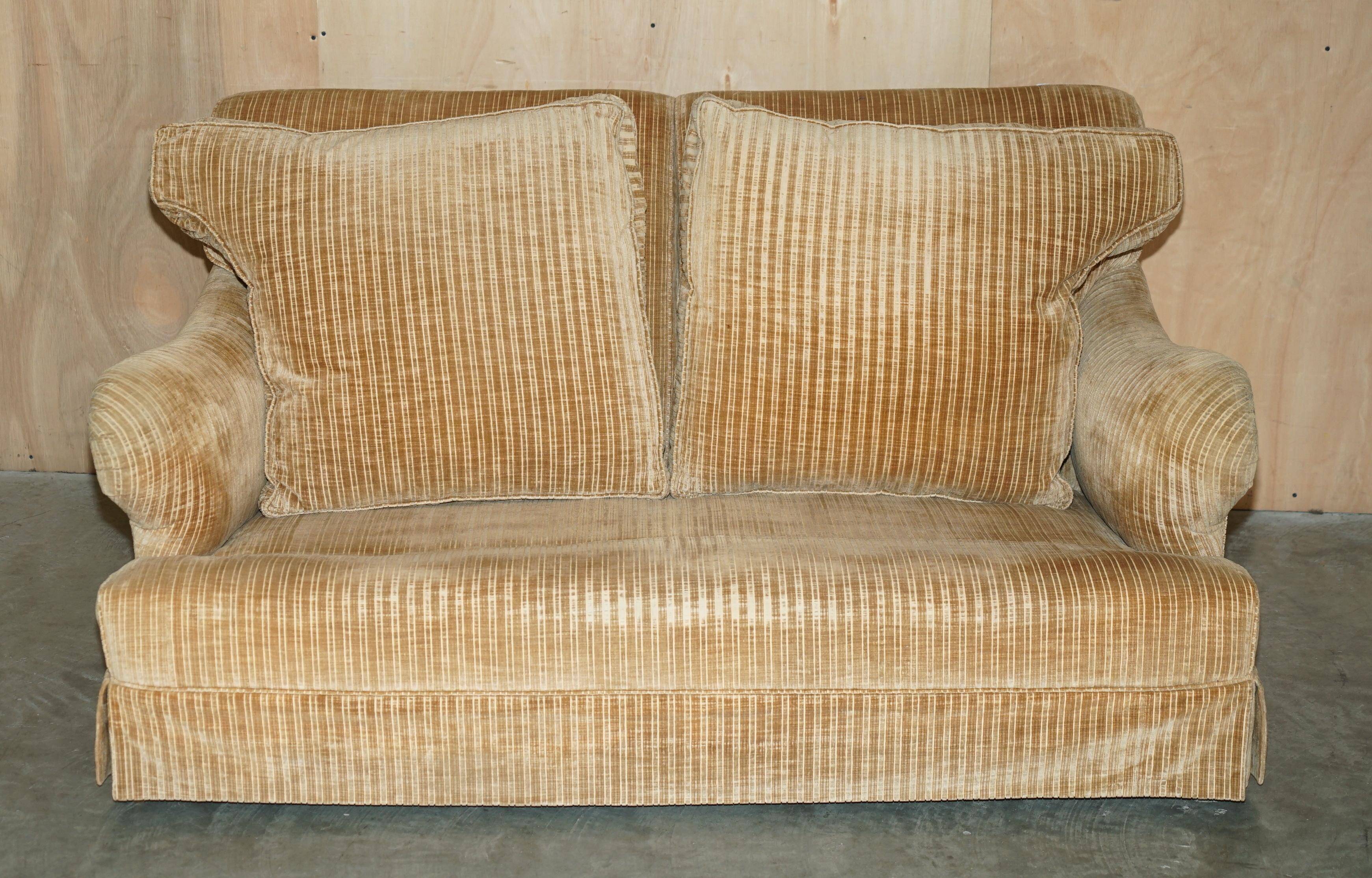 Howard & Sons / Chairs Ltd two-seater canapé with feather-filled cushions.