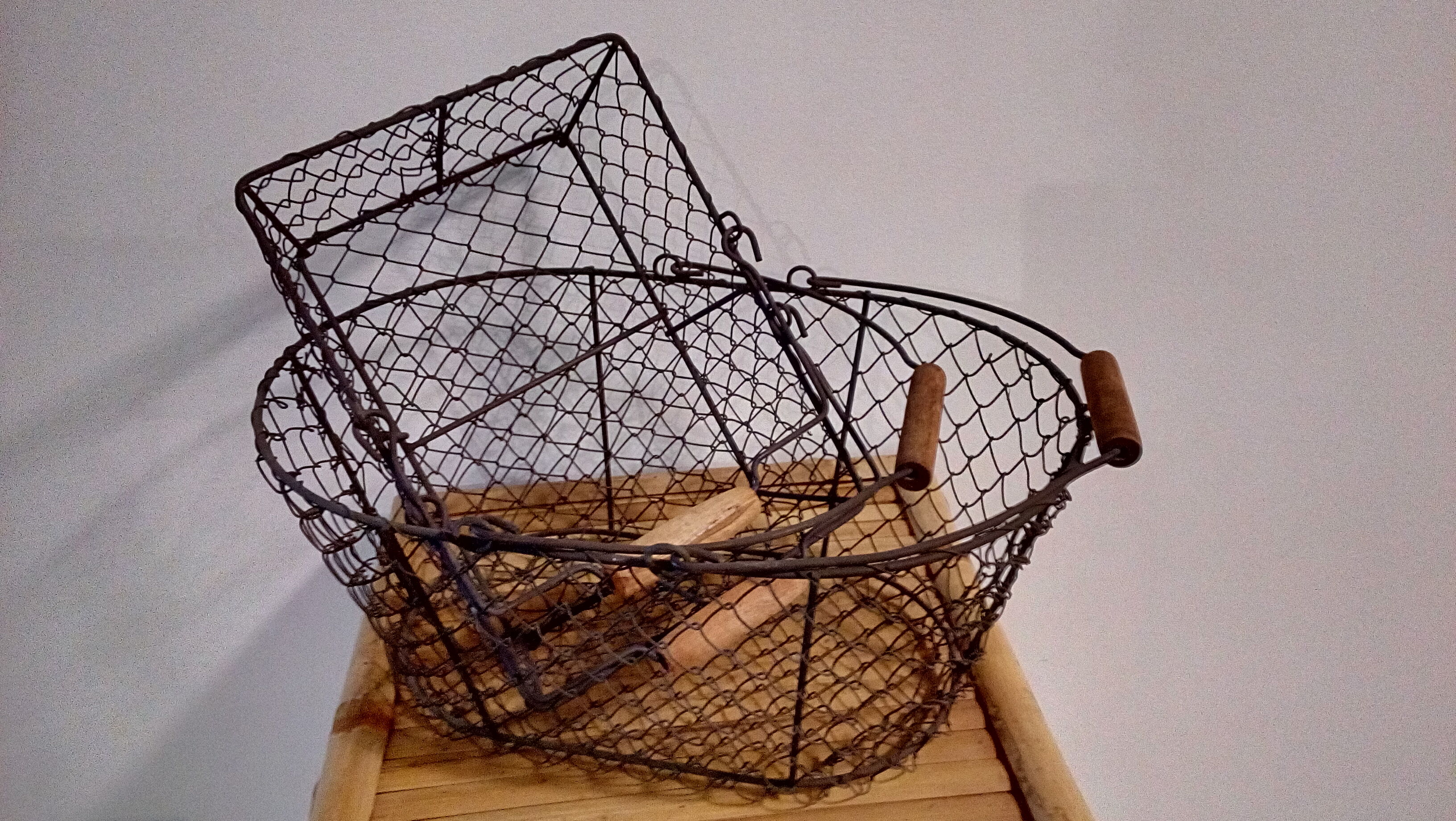 Duo of aged metal mesh baskets