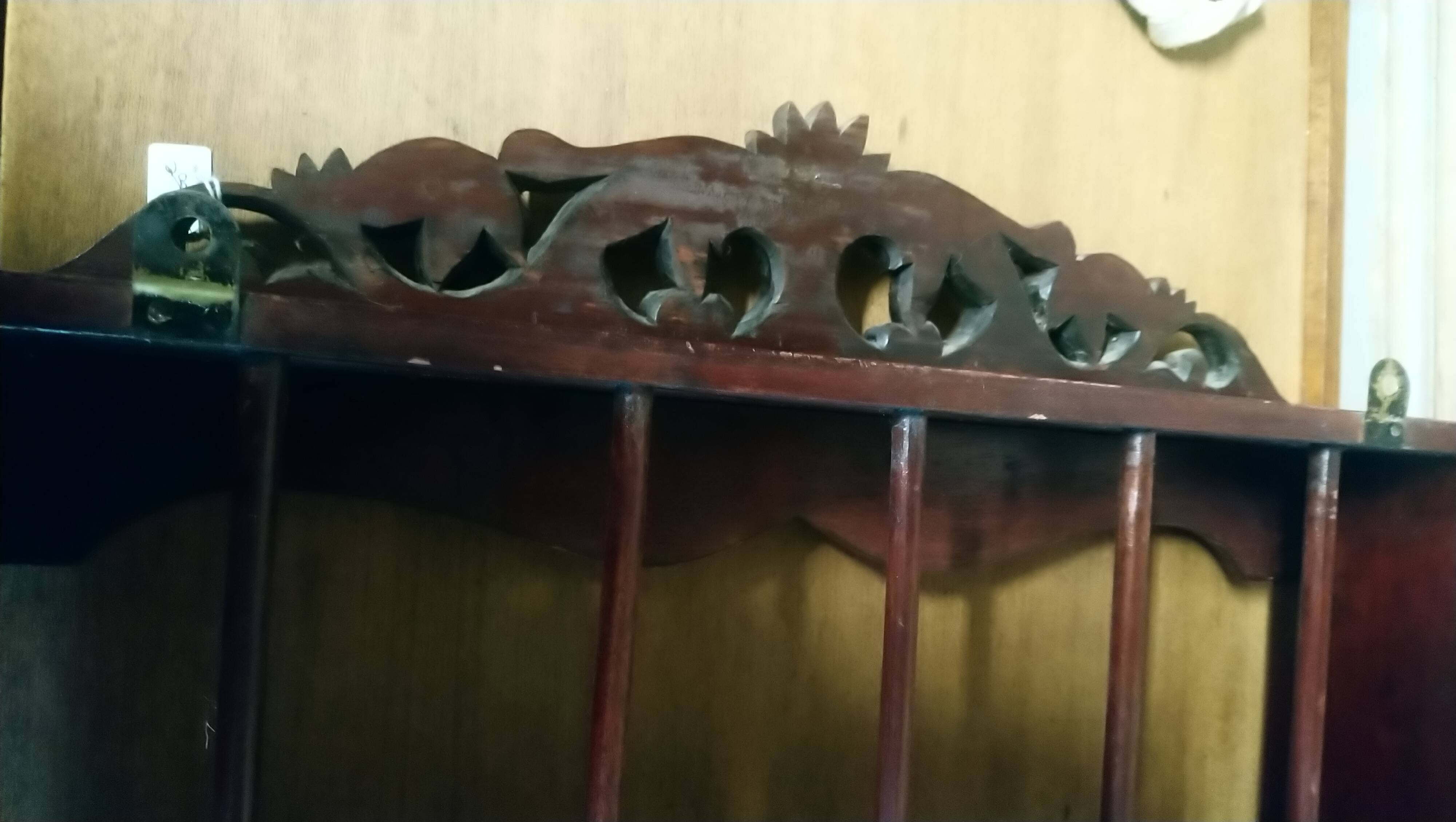 Carved wooden wall shelf for collection or other.