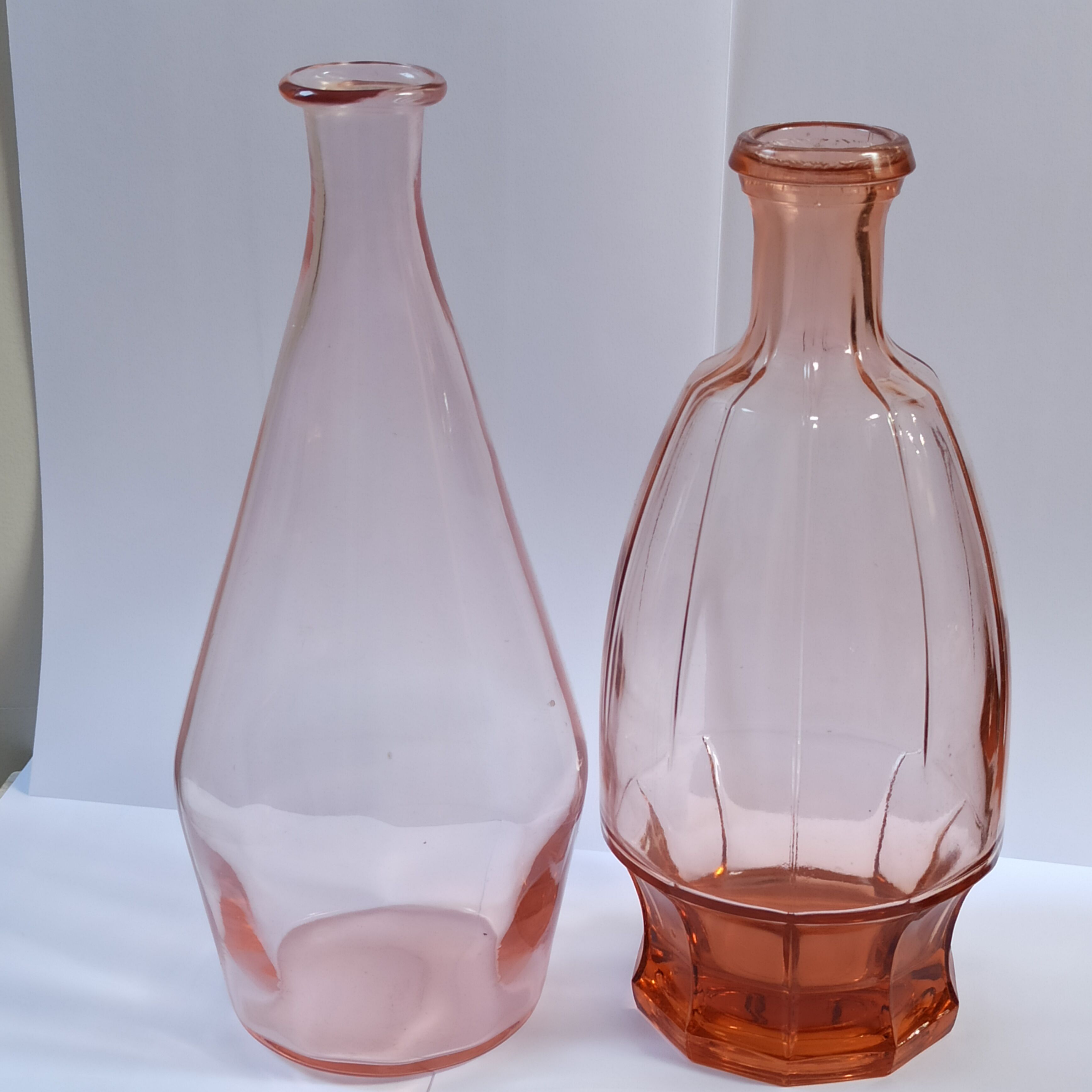 Vintage pink glass bottle vases