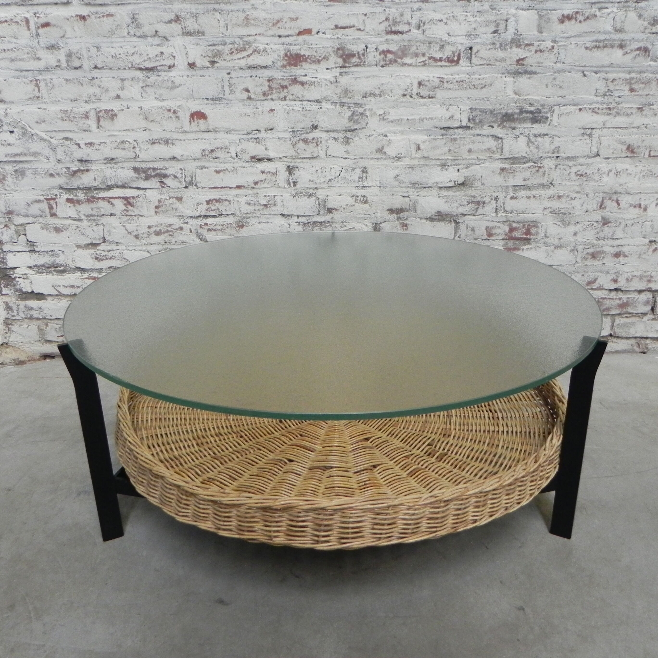 Vintage coffee table with glass top and rattan basket