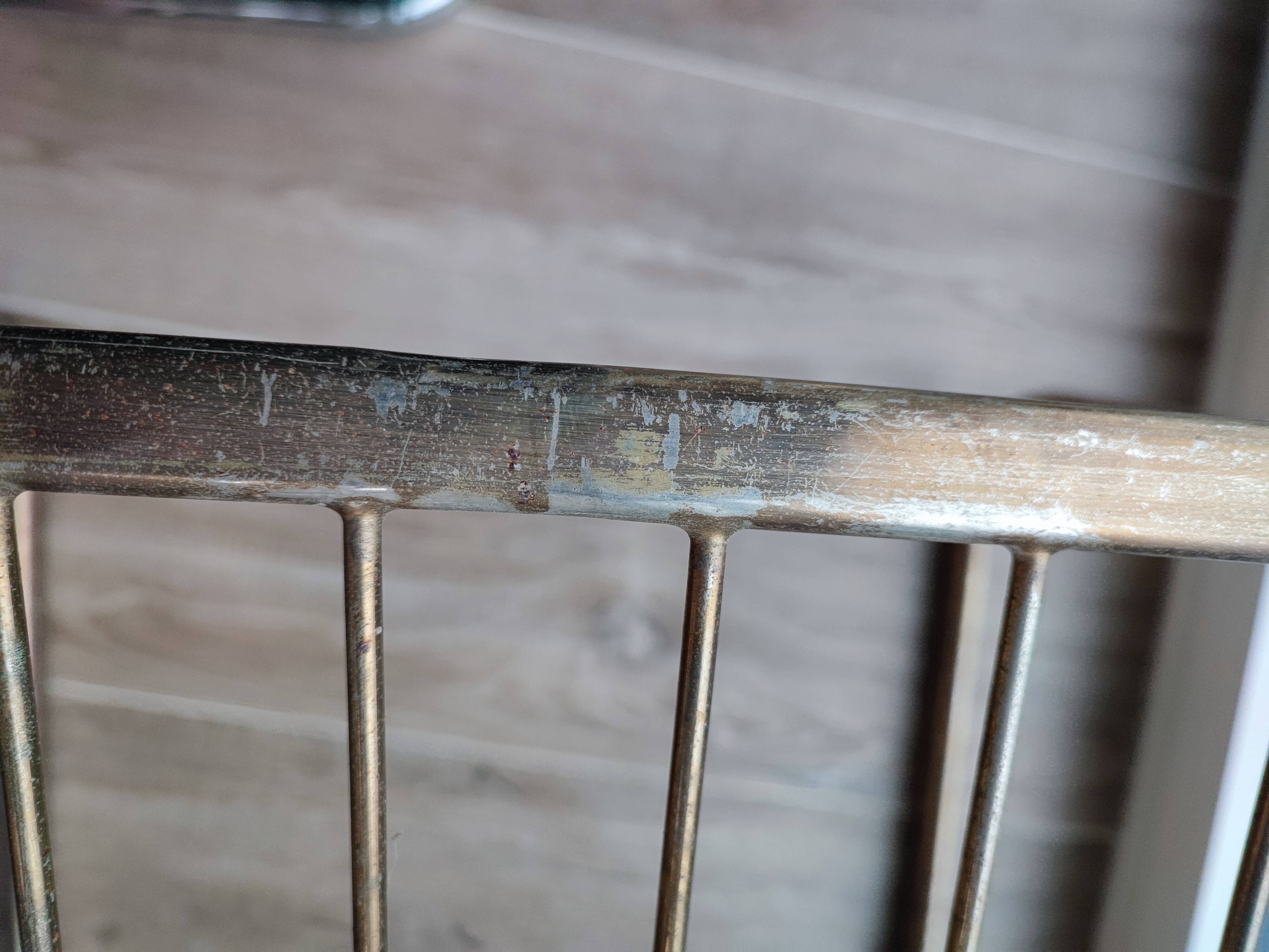 Tubular metal chair covered with gilding