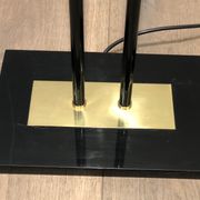 Black lacquered metal floor lamp with brass.