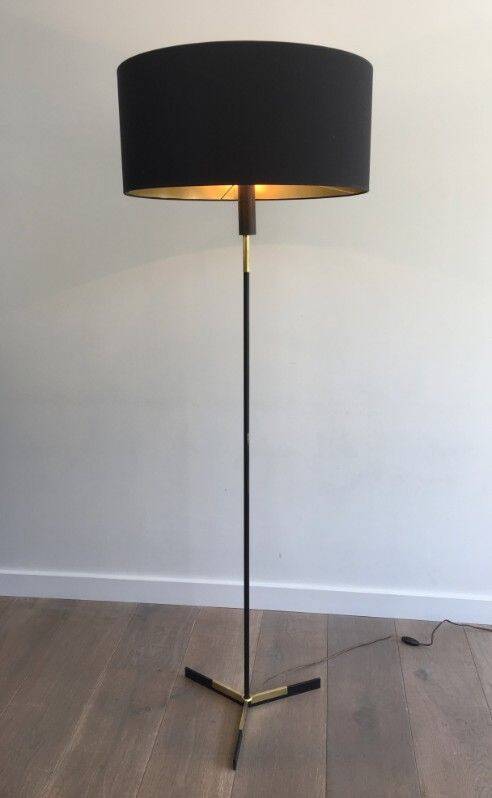 Designer floor lamp in black lacquered metal and brass