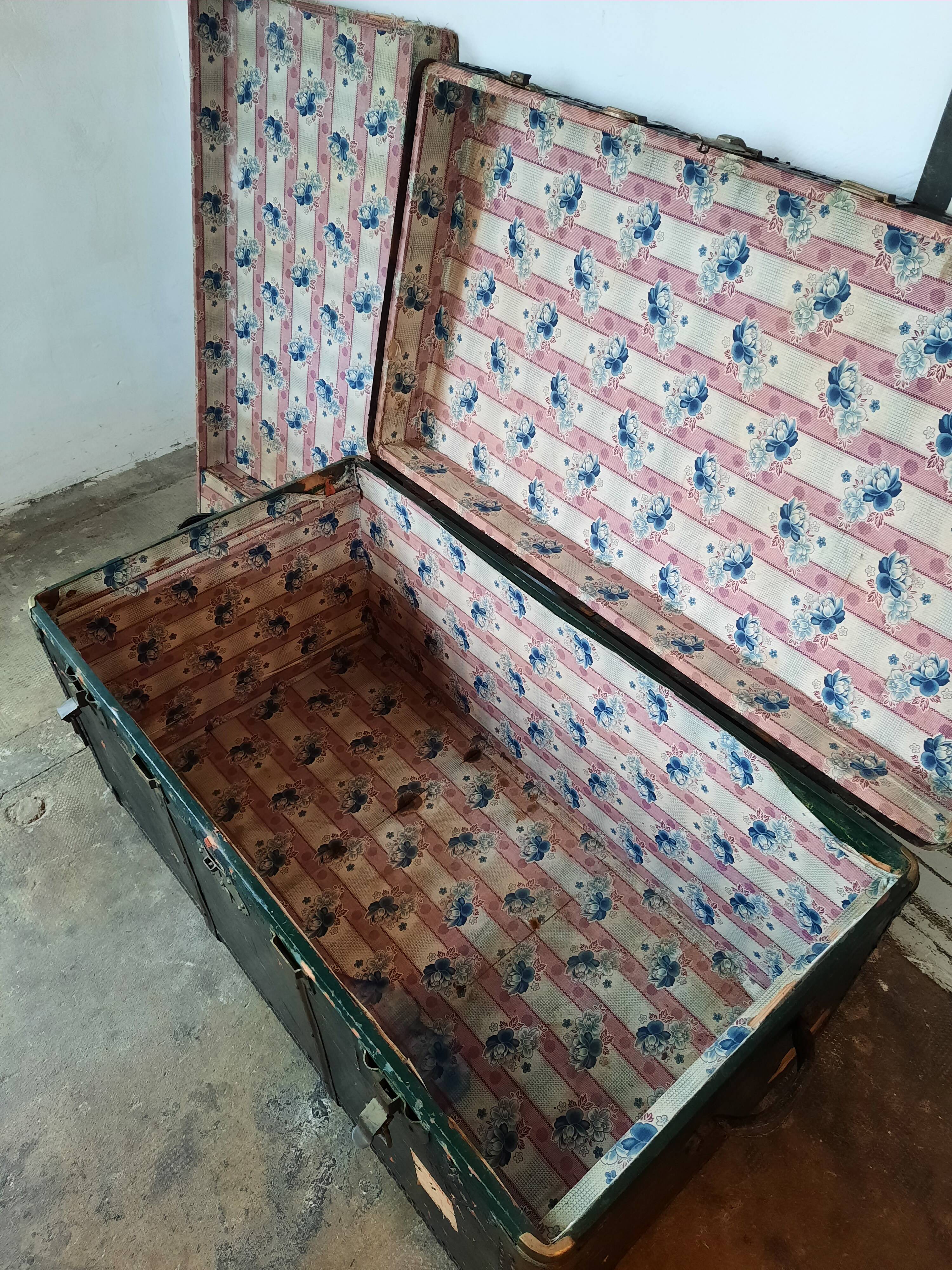 Old and large travel trunk, brass-plated corners