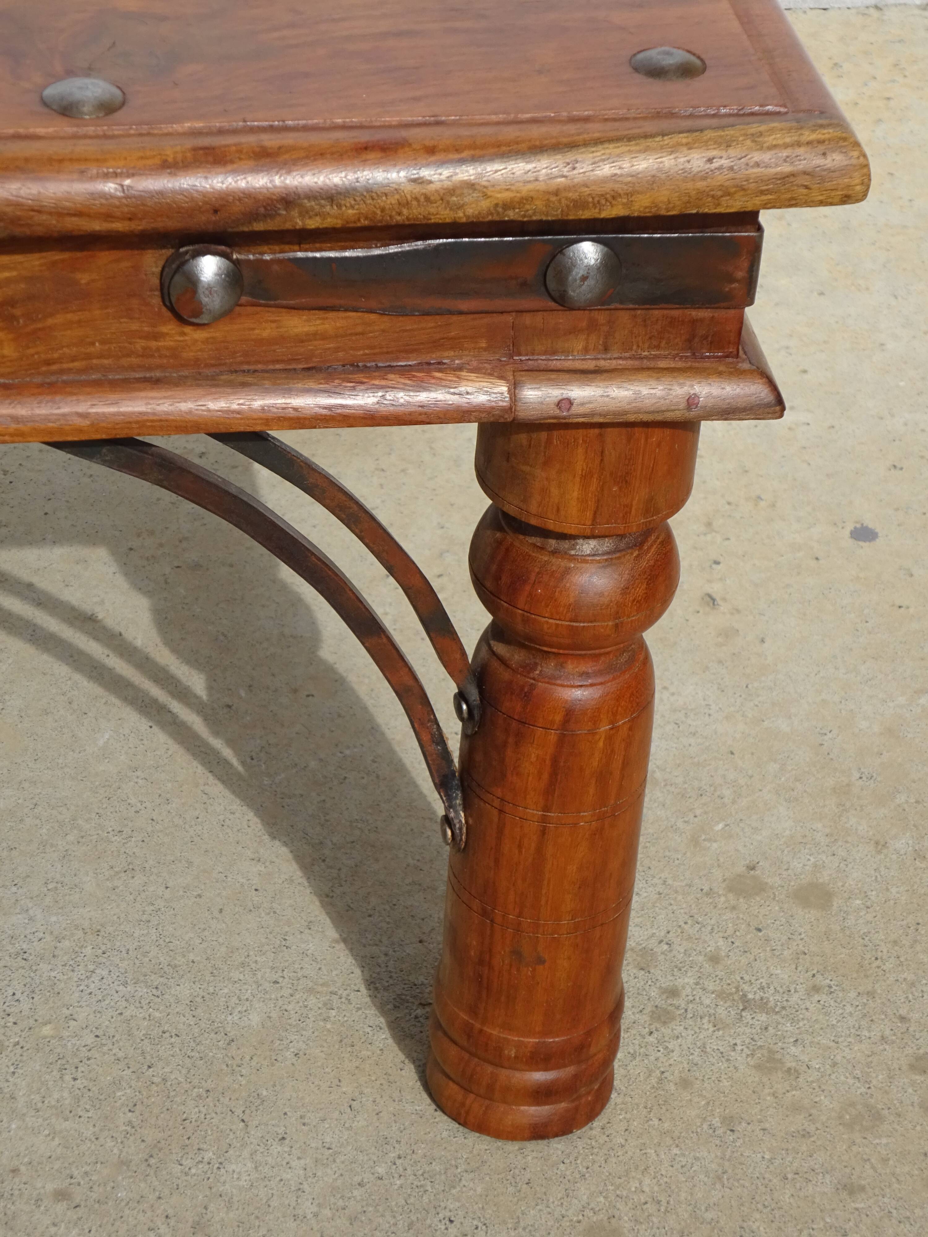 Square coffee table in exotic wood and wrought iron.