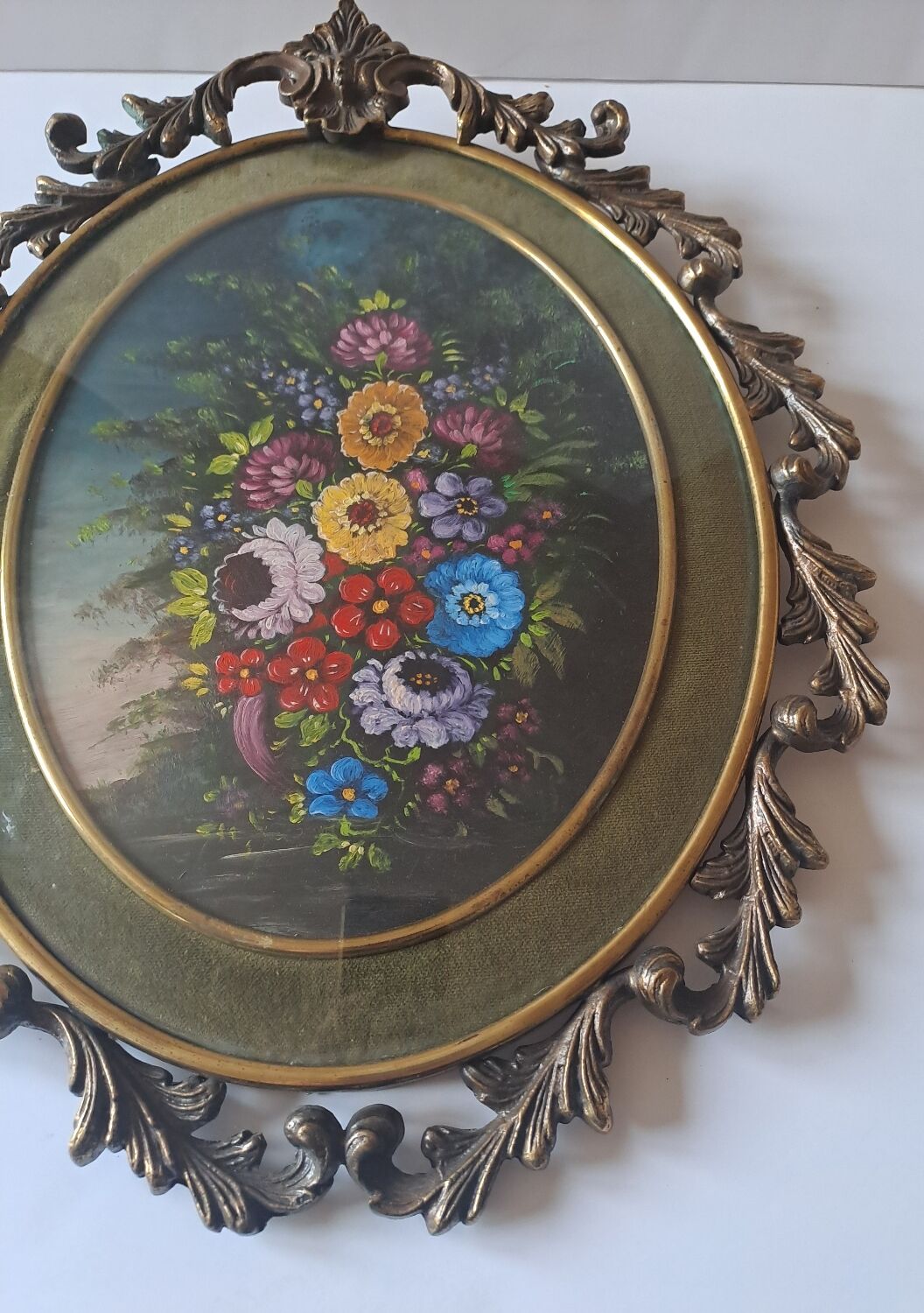 Painted under glass convex medallion in bronze