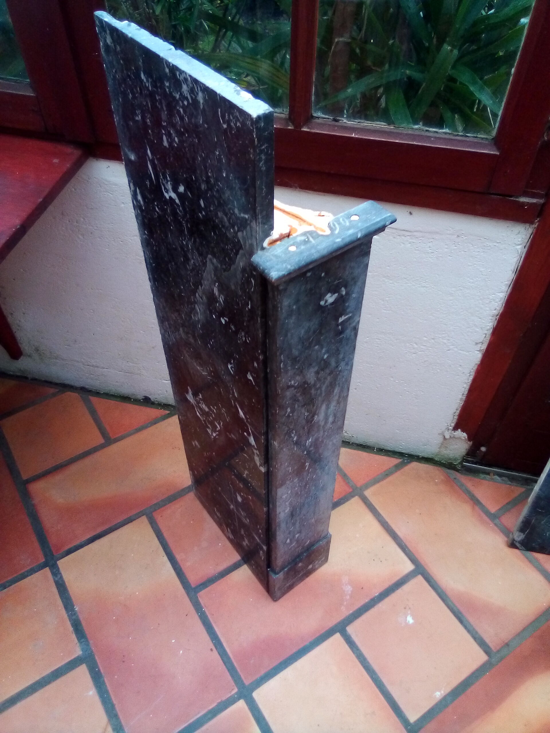 White veined black marble fireplace