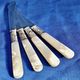 4 antique butter spreading knives in silver-plated metal and mother-of-pearl.