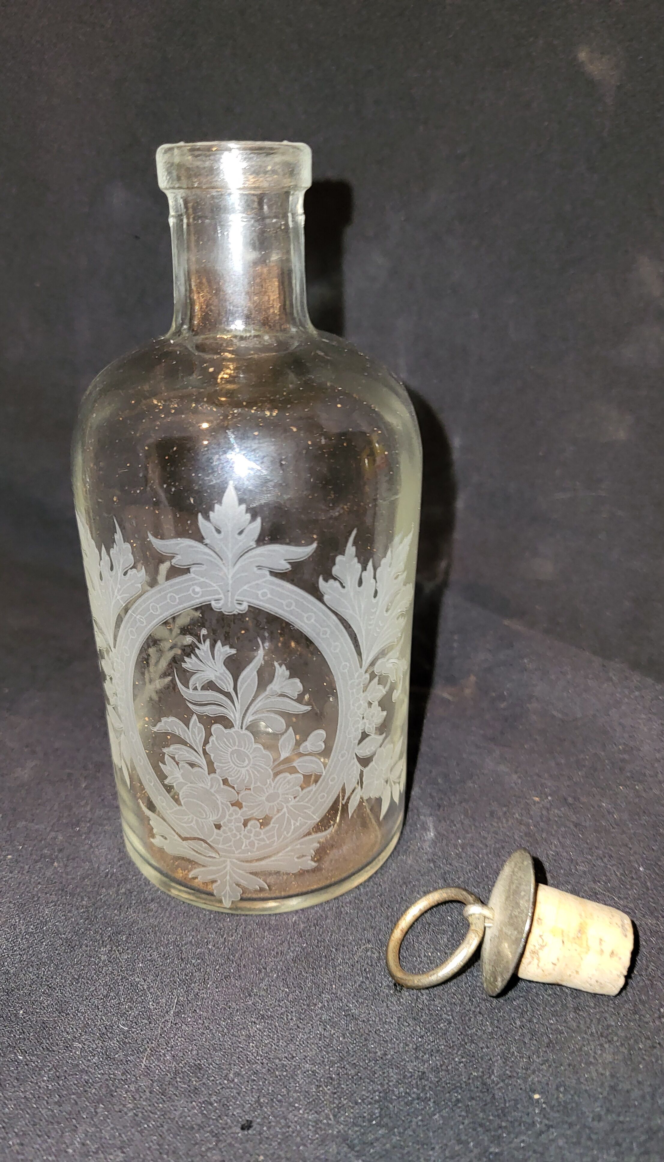 Engraved glass bottle