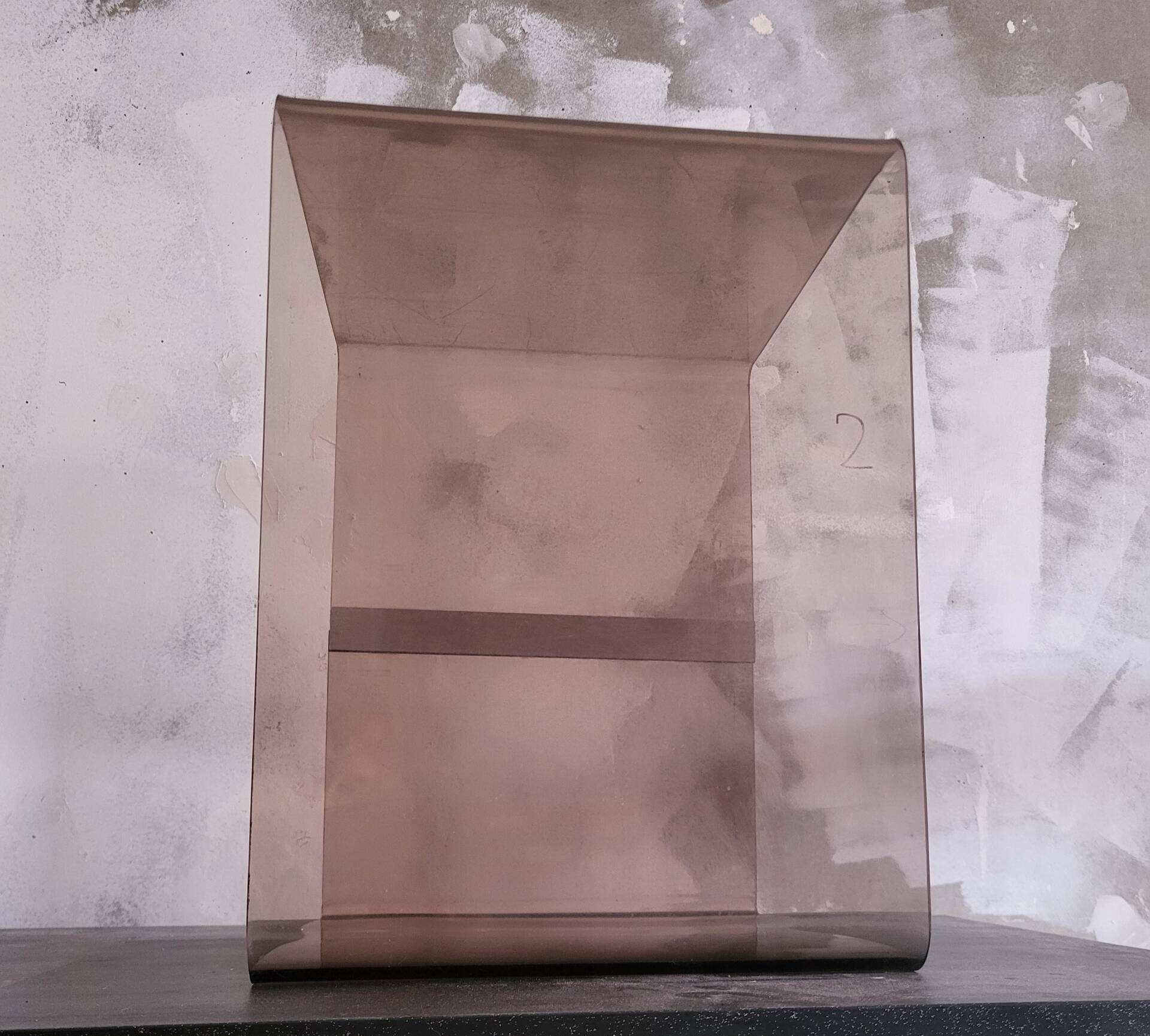 Rectangular piece of furniture or coffee table in smoked plexiglass by Michel Dumas.