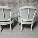 Pair of Louis XV style armchairs in patinated wood, light blue fabric.