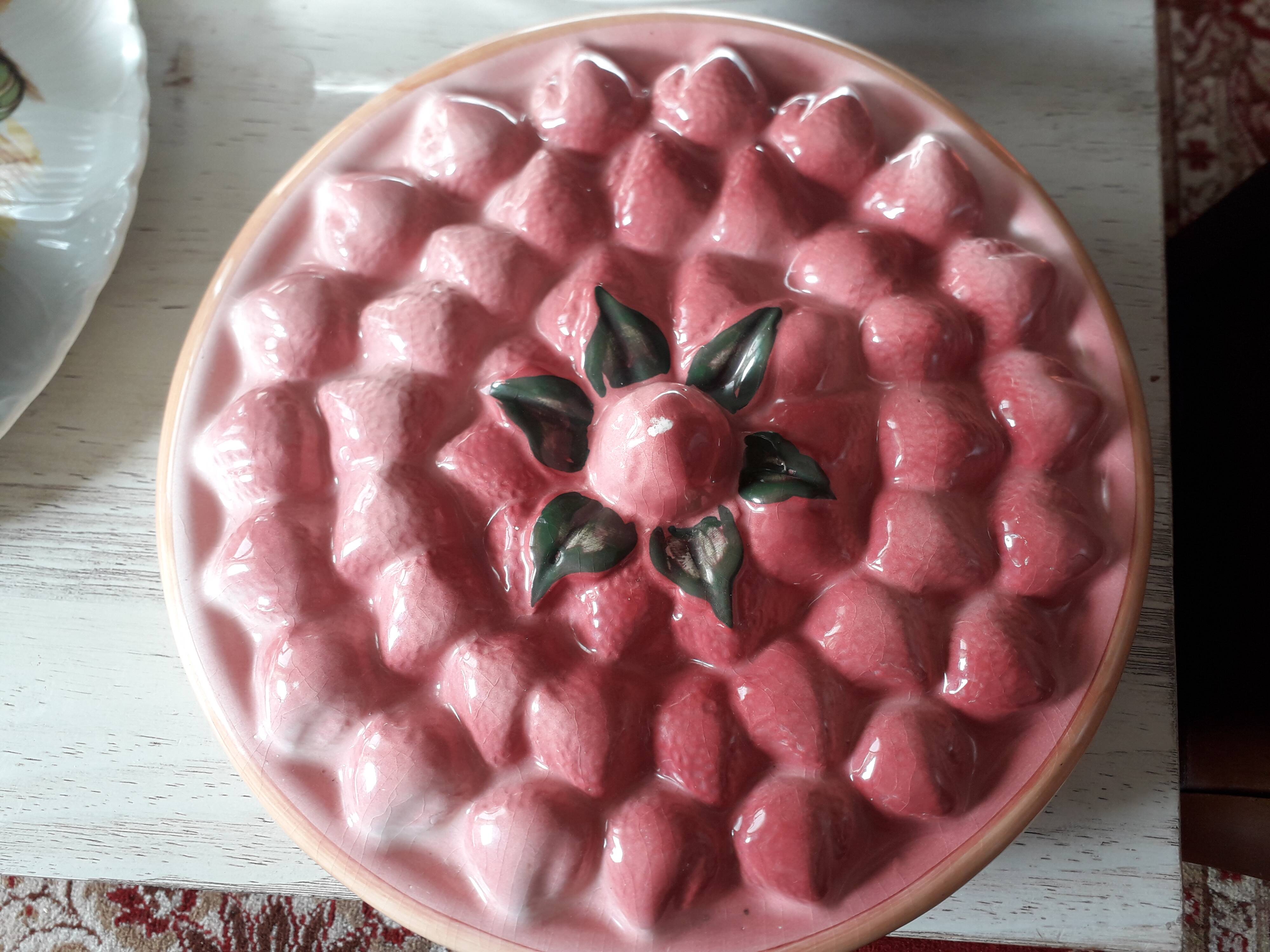 Glazed ceramic dessert plate with strawberry design.