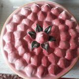 Glazed ceramic dessert plate with strawberry design.