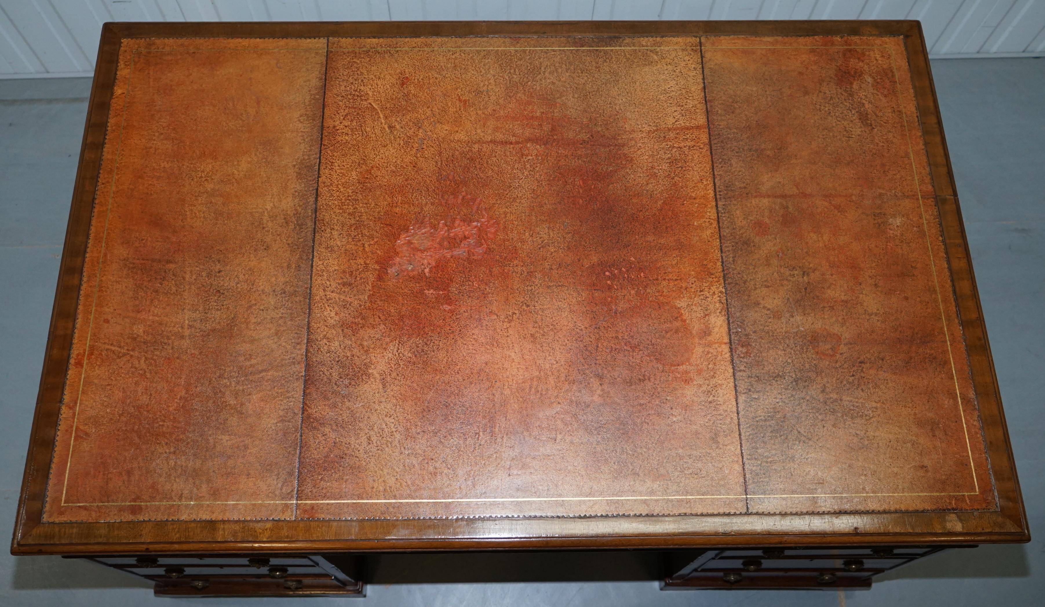 Double-sided partner's desk in walnut, George III, circa 1780, with lion head handles.