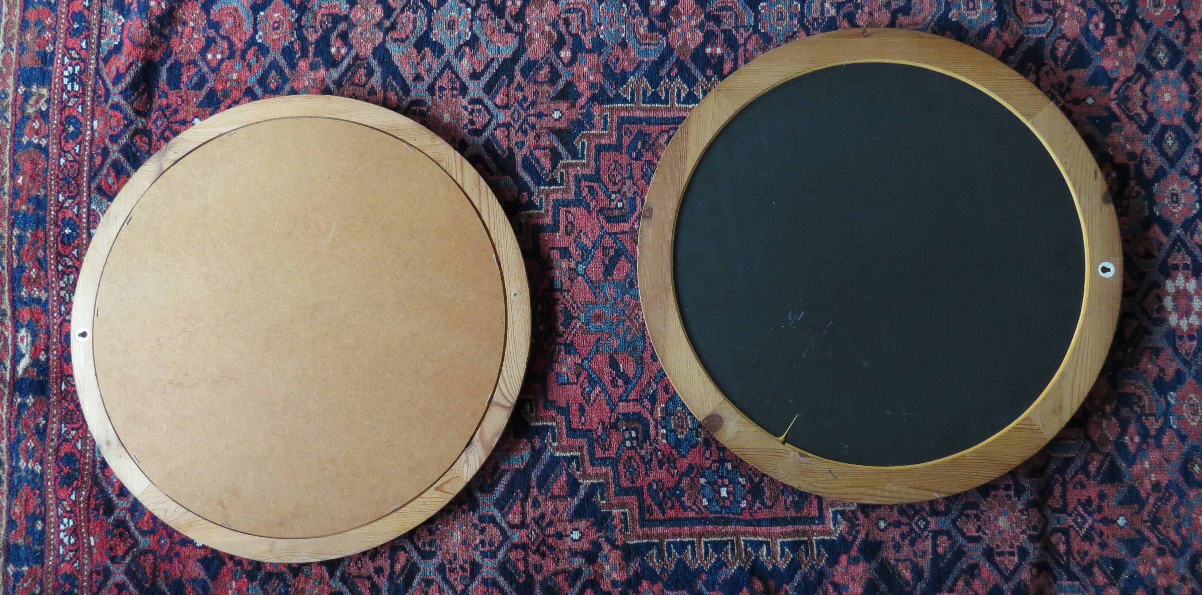 Pair of round Scandinavian pine mirrors from the 70s