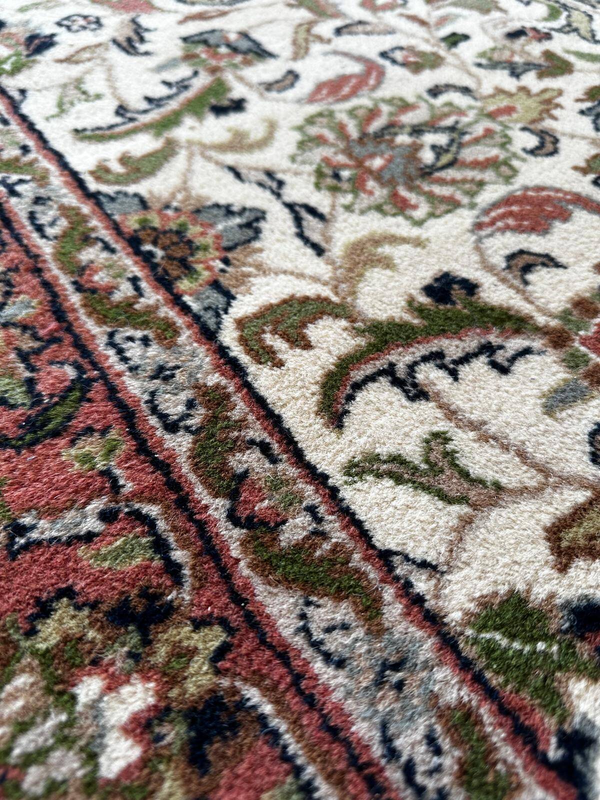 Handmade oval Persian rug 185cm x 120cm