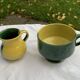 Enameled ceramic bowl and milk jug, two-tone yellow and green, vintage 1950