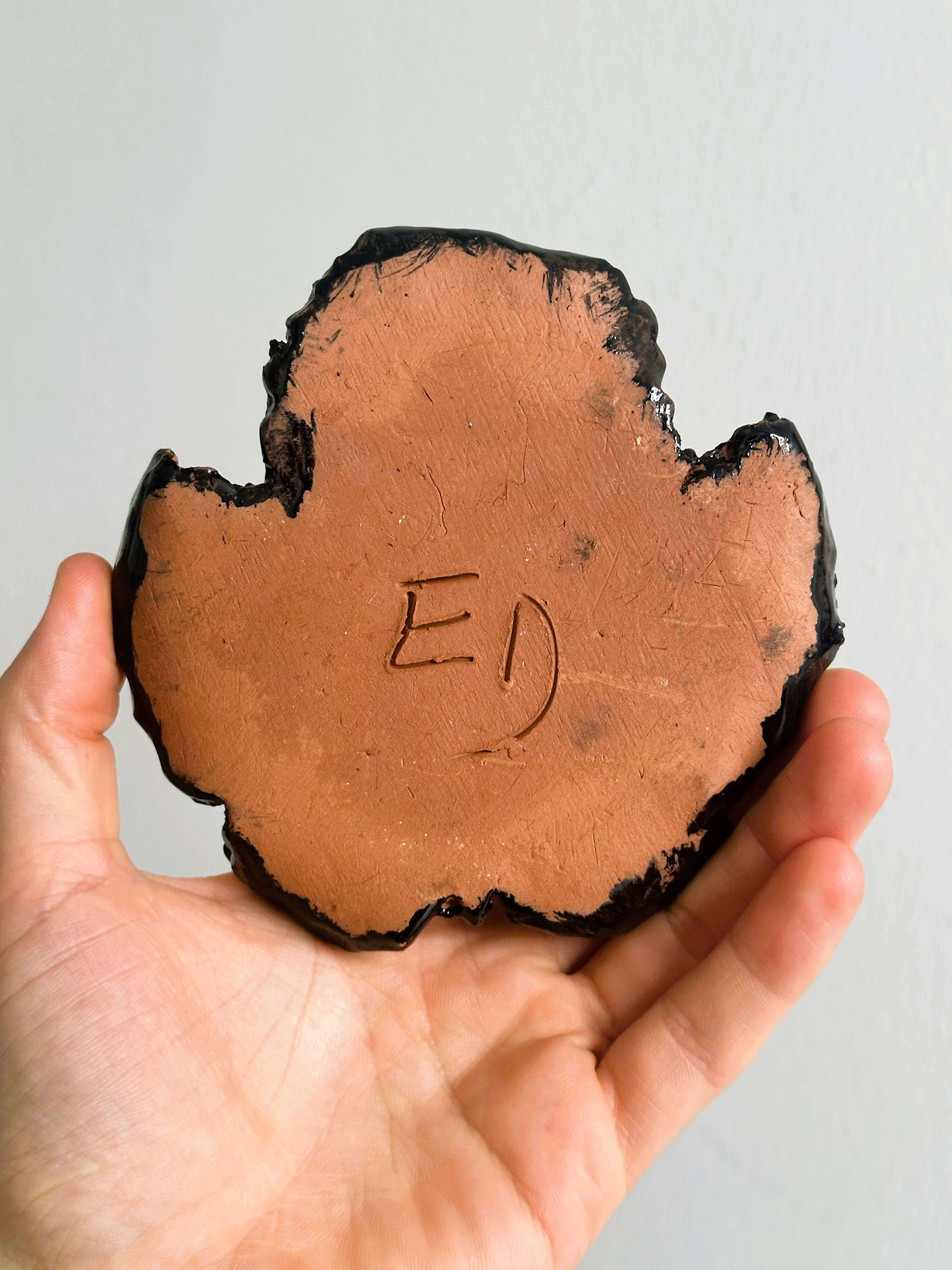 Handcrafted enameled black ceramic pocket emptier