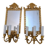 Pair of wall lights with mirror backgrounds with 3 arms of lights in chiseled and gilded bronze. framing decorated with foliage and masks. louis xiv style