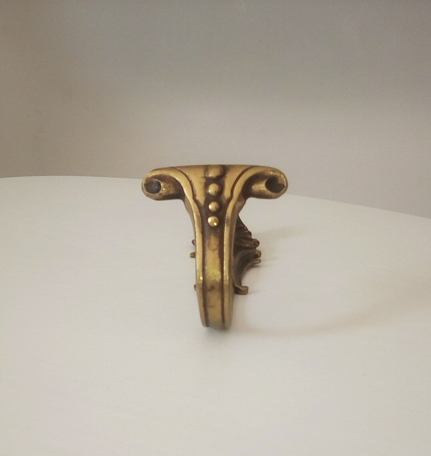 Old brass coat rack hook