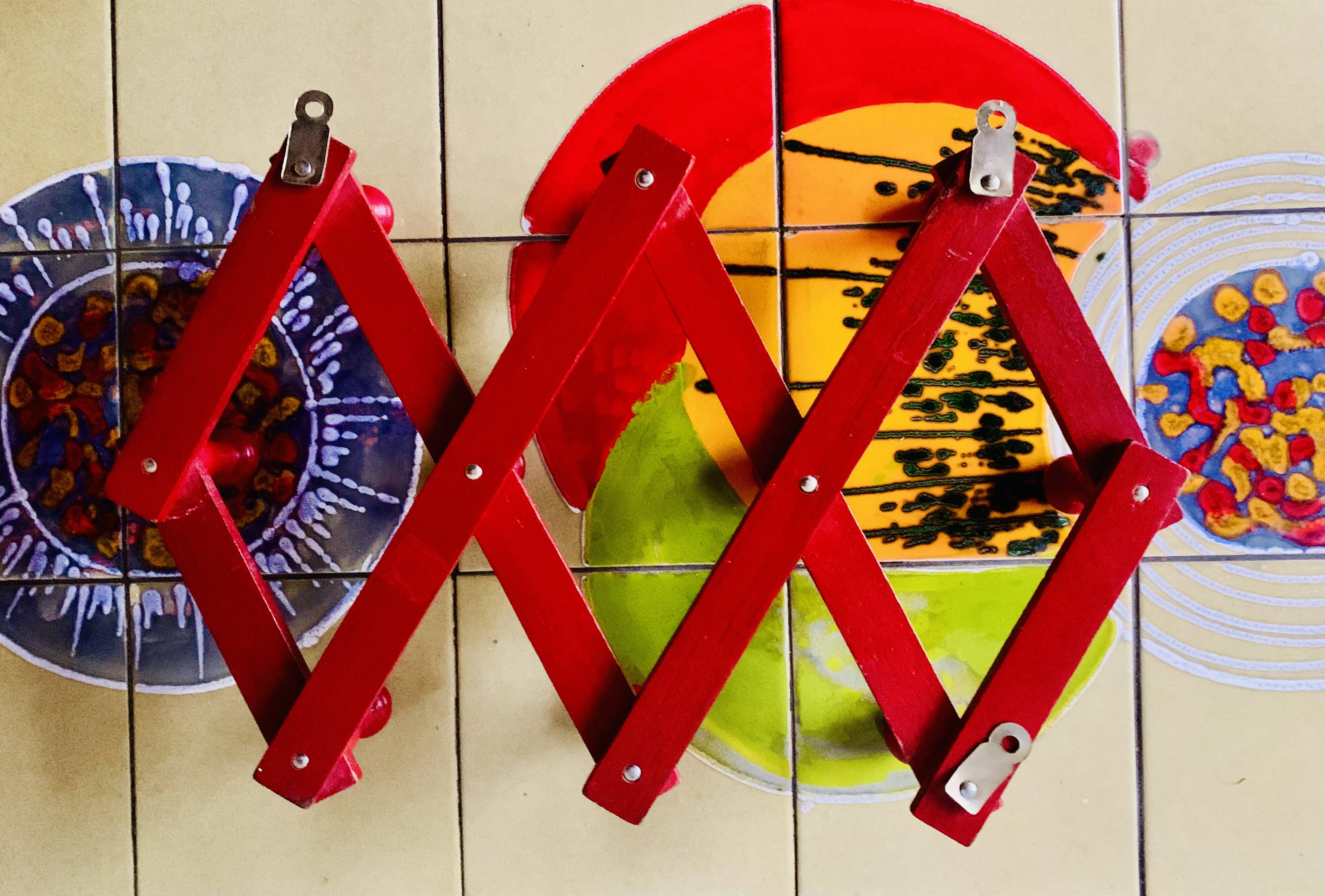 Vintage accordion coat rack in red painted wood