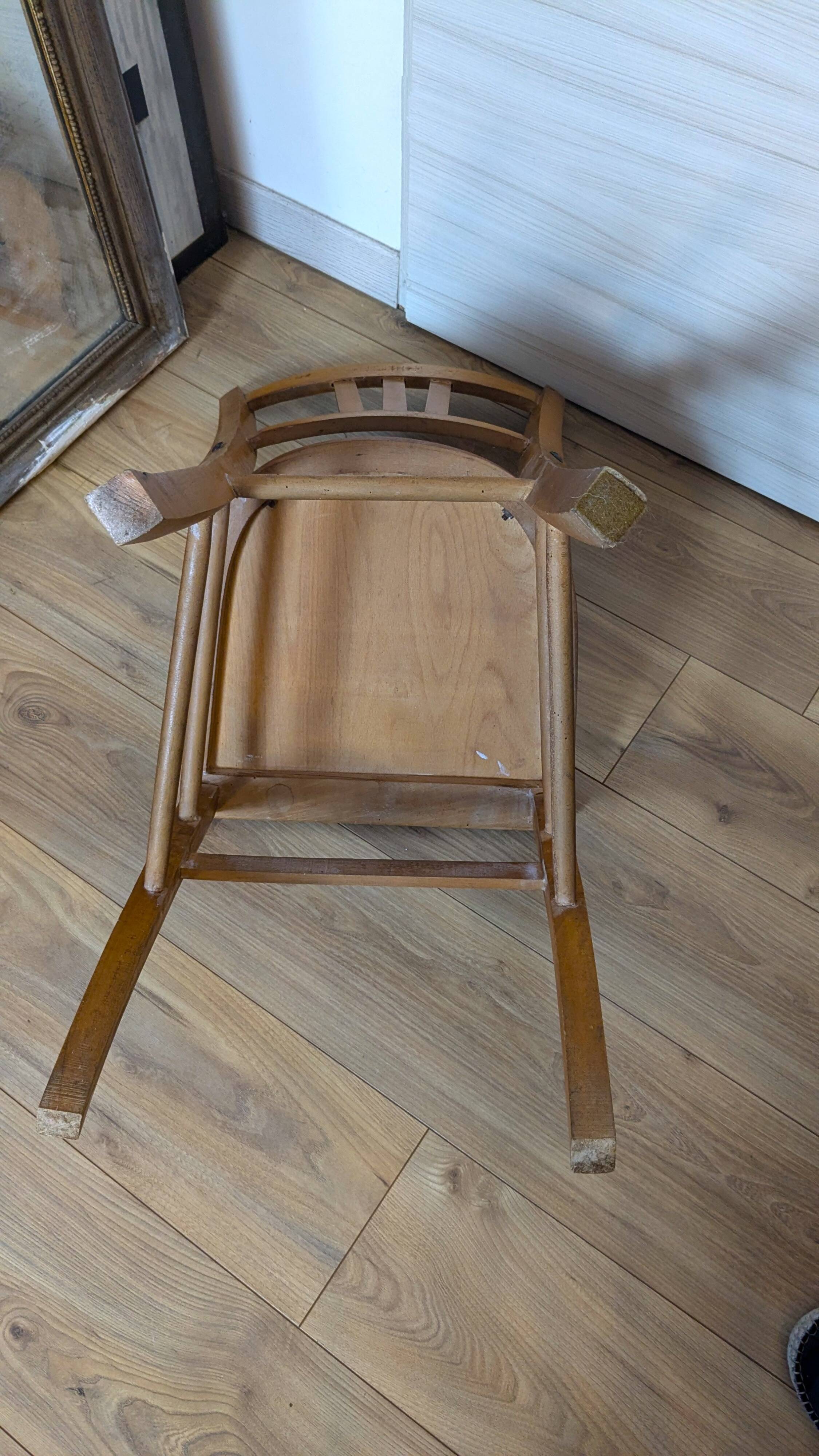 Antique patinated wooden bistro chair from the early 20th century.