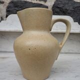 Beige ceramic pitcher