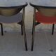 4 gondola-style chairs with a sturdy metal frame and faux leather.