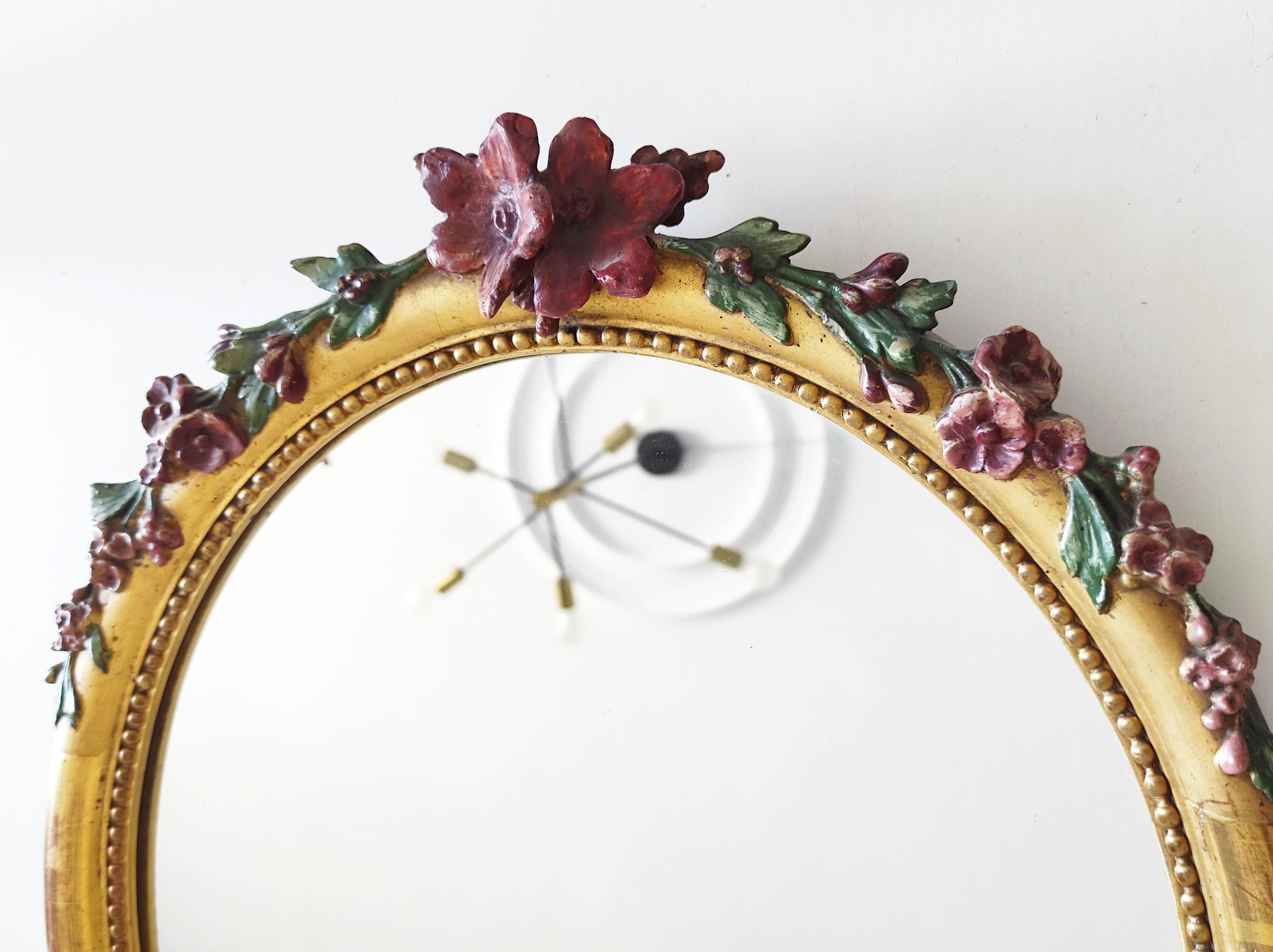 Miroir en bois doré avec fleurs