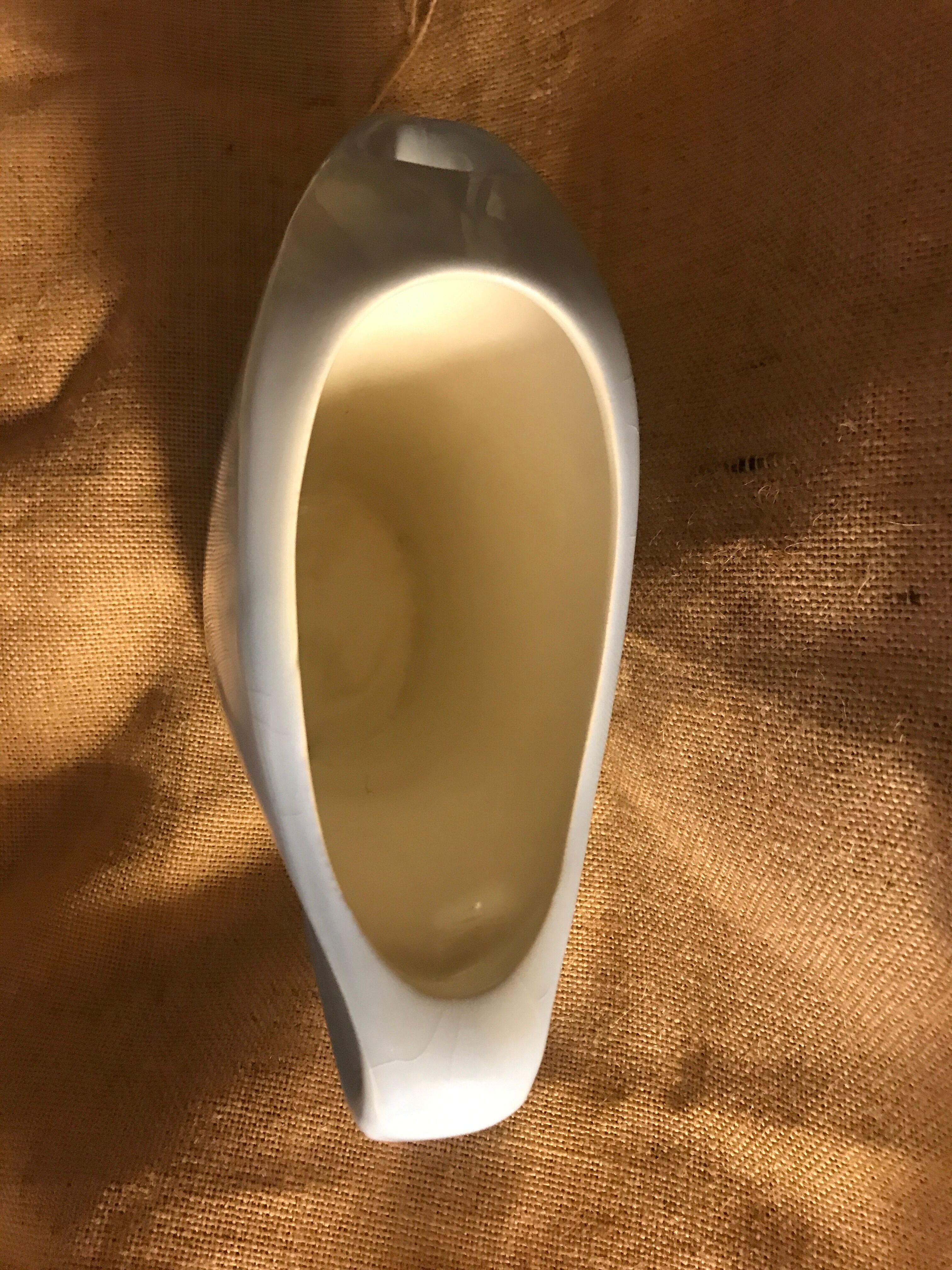 Light blue pitcher in vintage earthenware