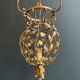 Important golden iron lantern with foliage decorations from the Baguès house.