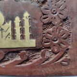 Old wooden box carved with flowers and brass