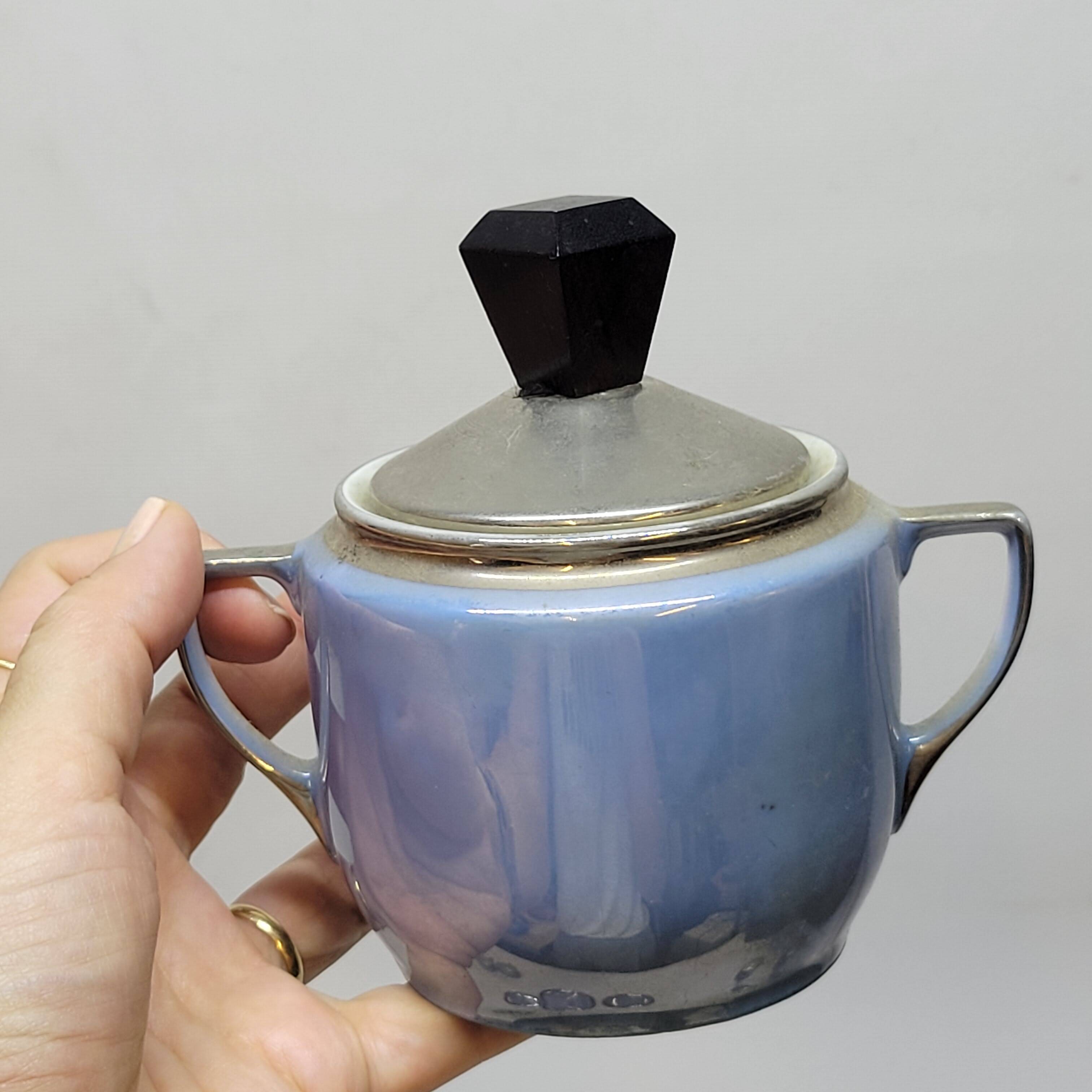 Art deco coffee service in fine iridescent blue porcelain, metal and wood