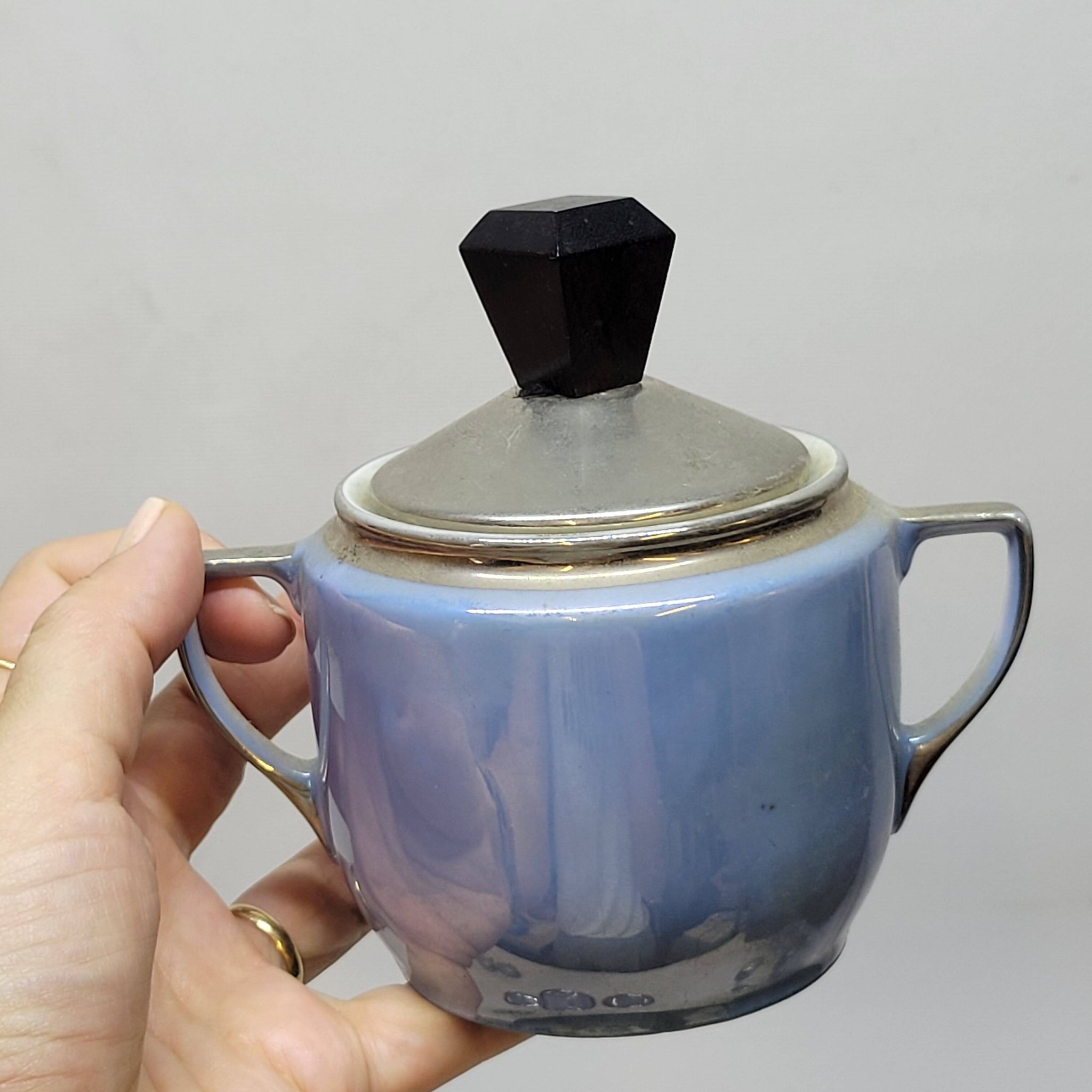 Art deco coffee service in fine iridescent blue porcelain, metal and wood